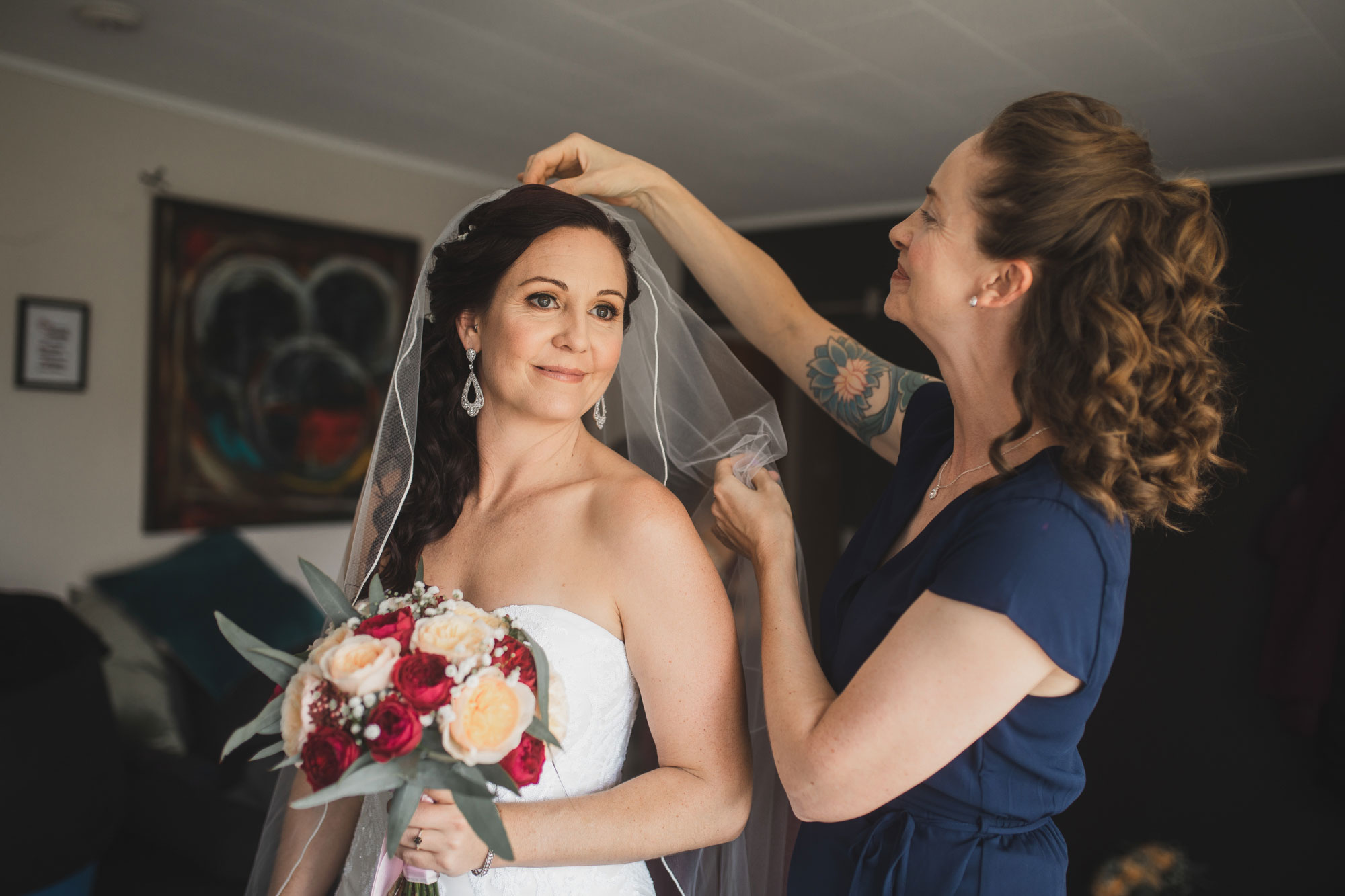 bride putting on veil