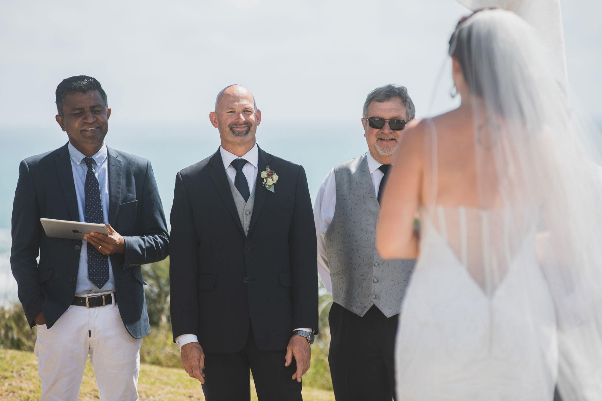 groom looking at the bride