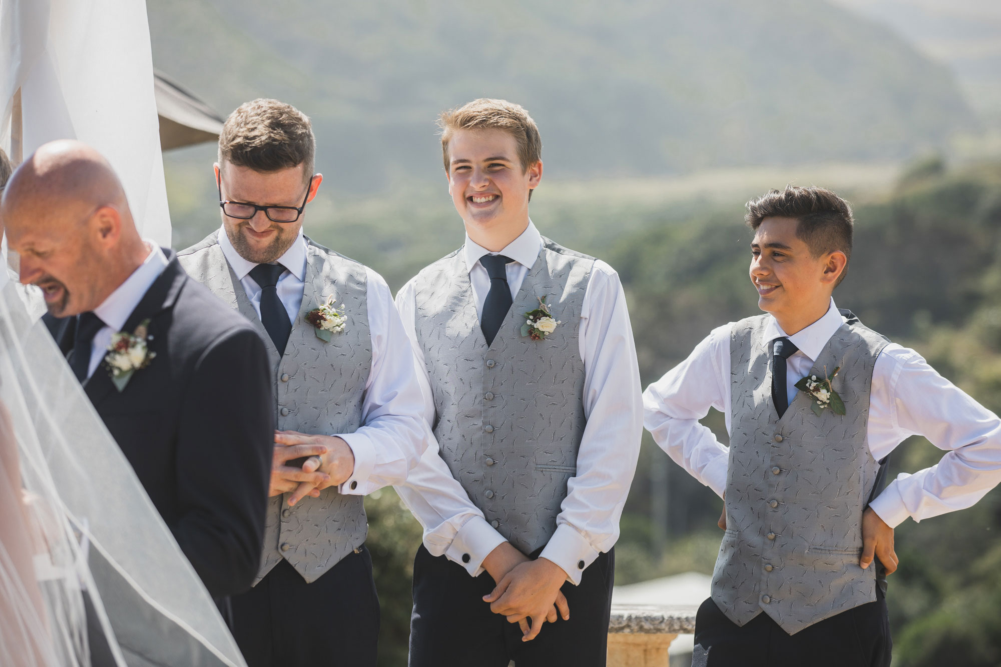 groomsmen smiling