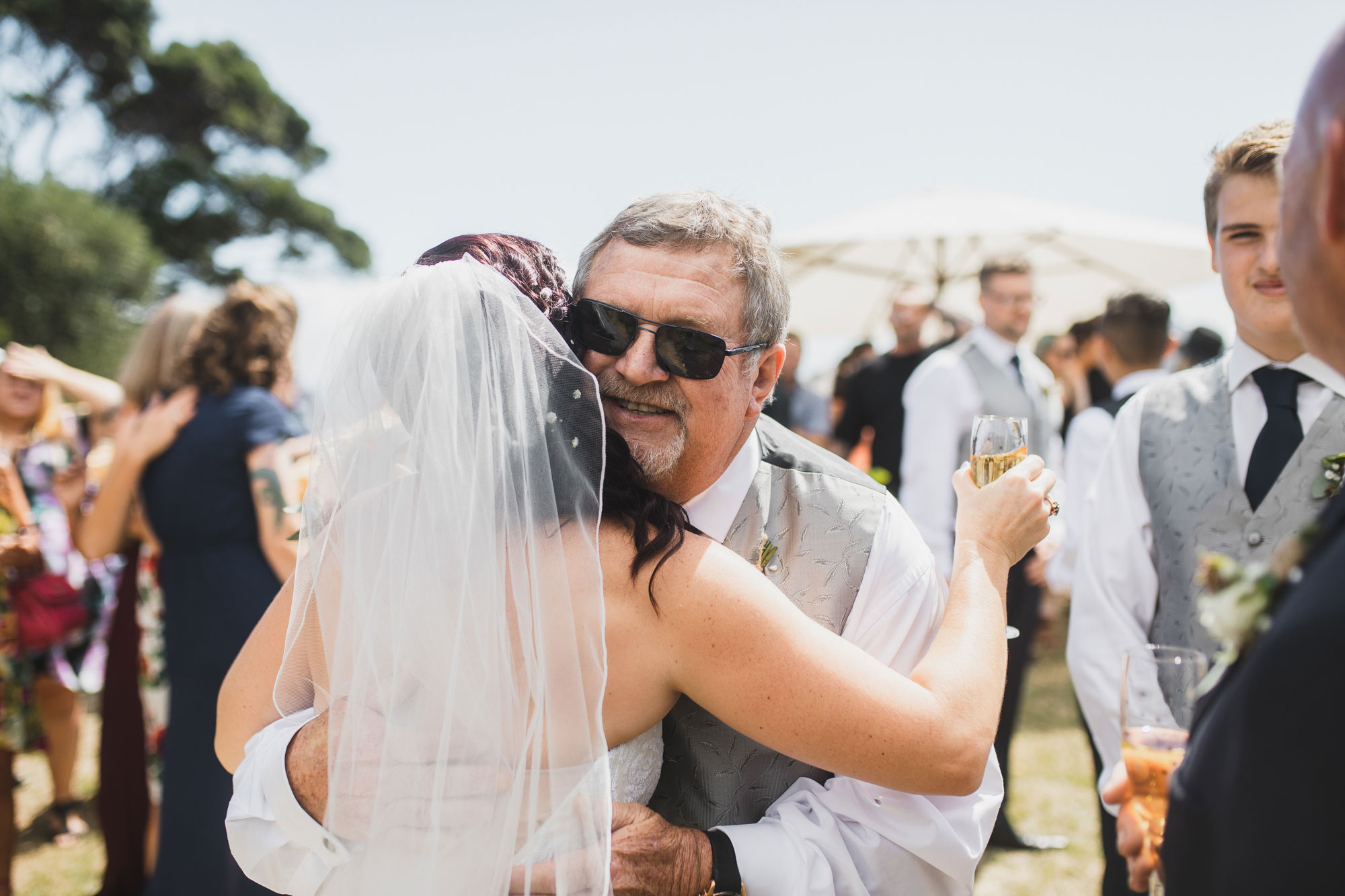 groomsman hugging bride