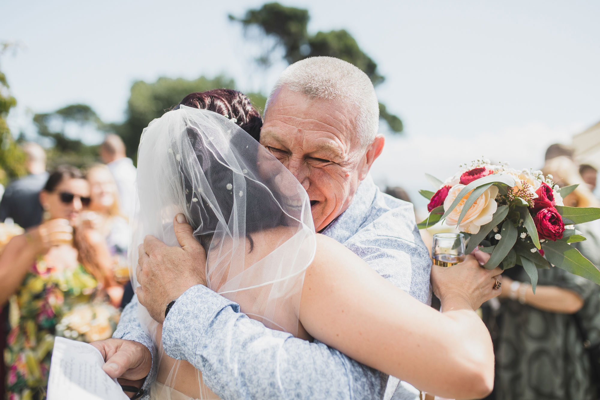 wedding guest hugging bride