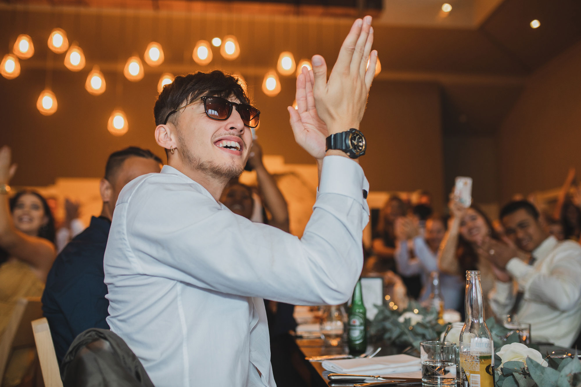 hawke's bay wedding reception guest clapping