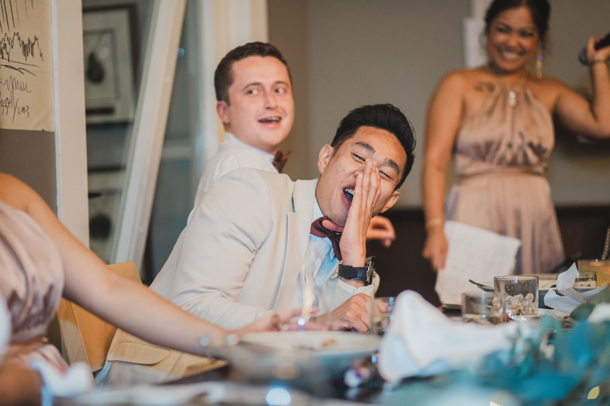 hawke's bay wedding groomsman laughing