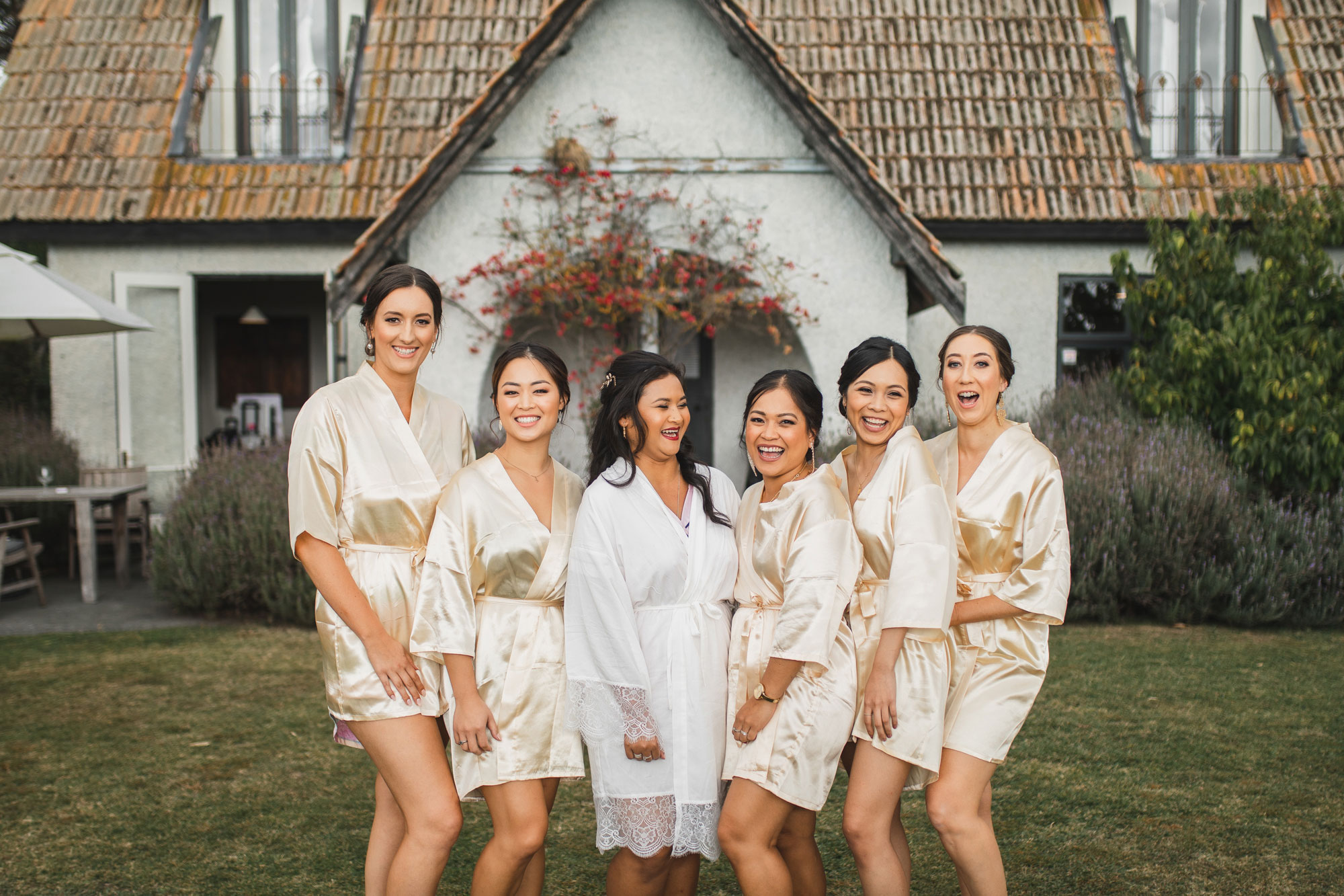 hawke's bay wedding bridal party laughing