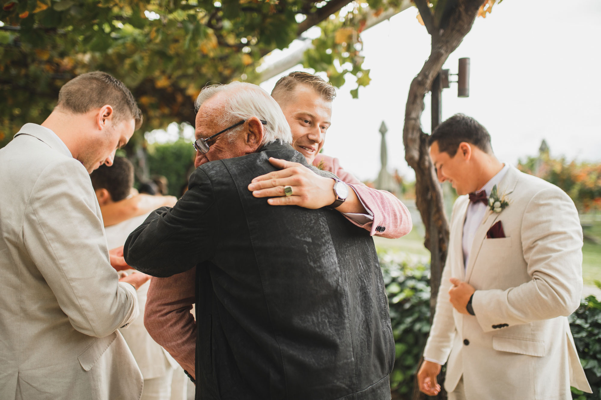 hawke's bay wedding groom hug guest