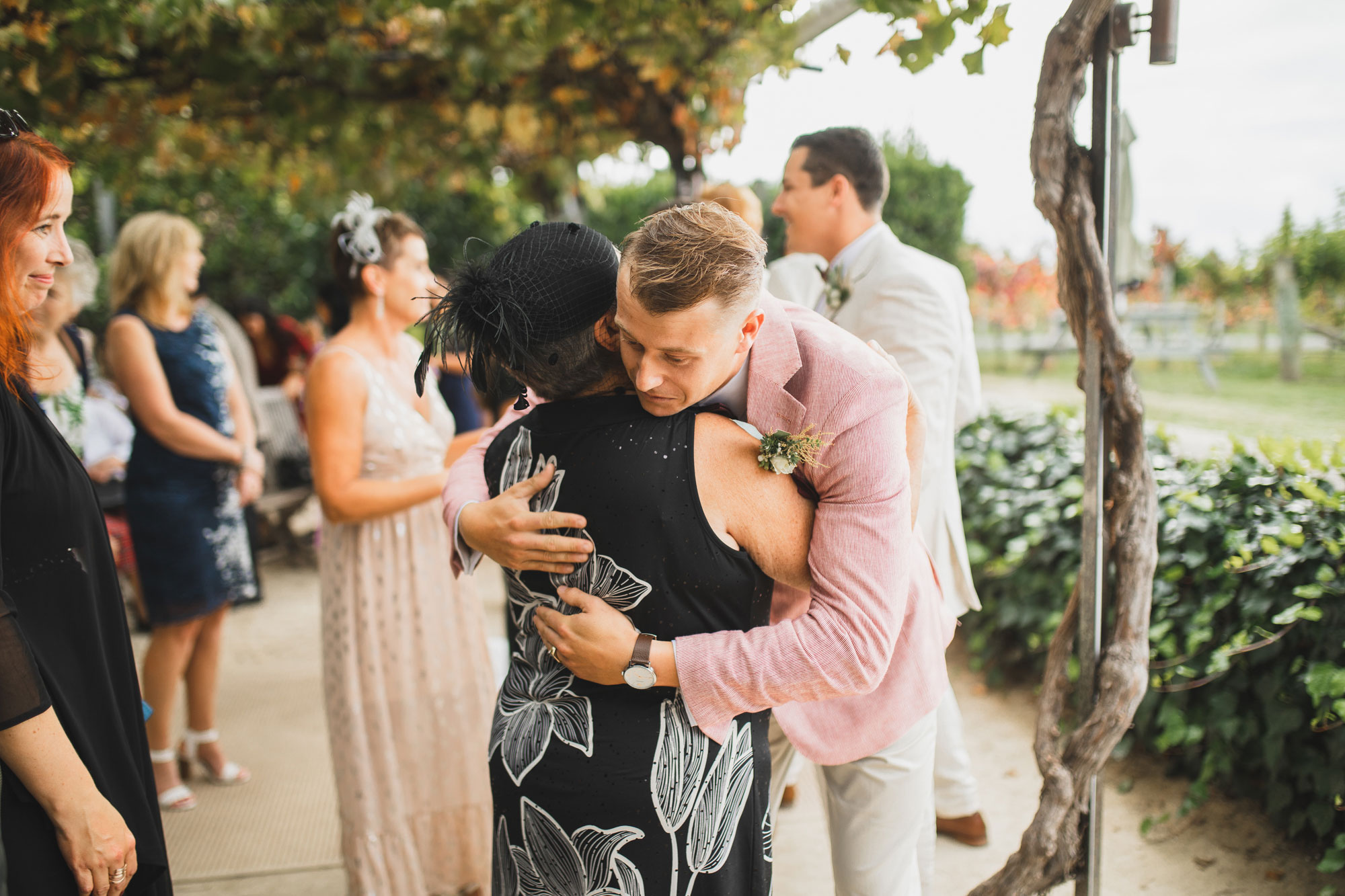 hawke's bay wedding groom hugging family