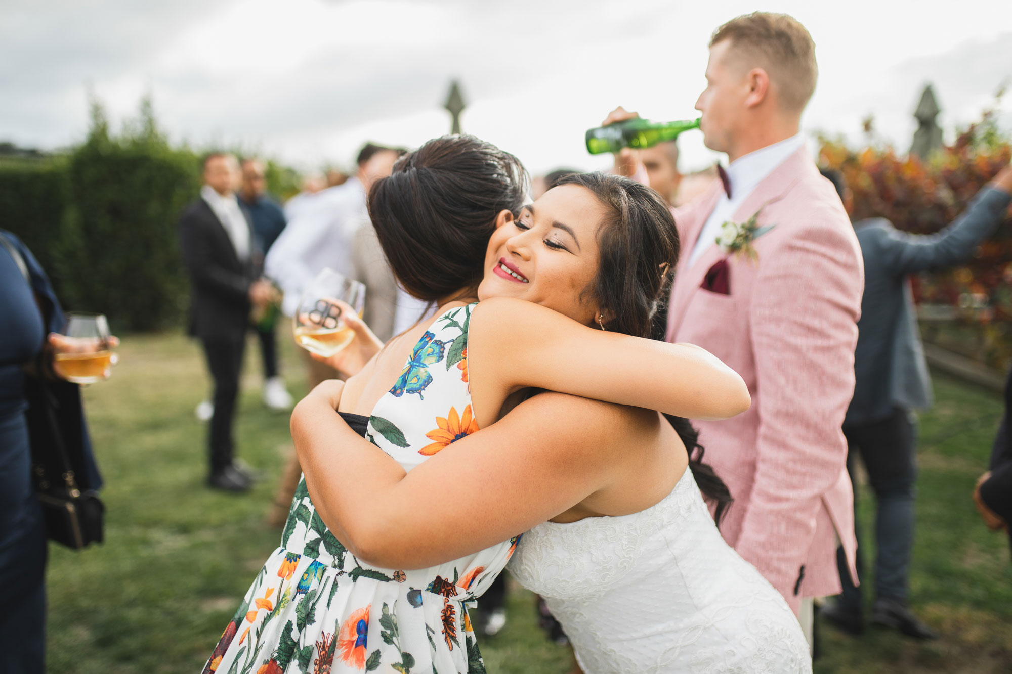 hawke's bay wedding bride hugging guest