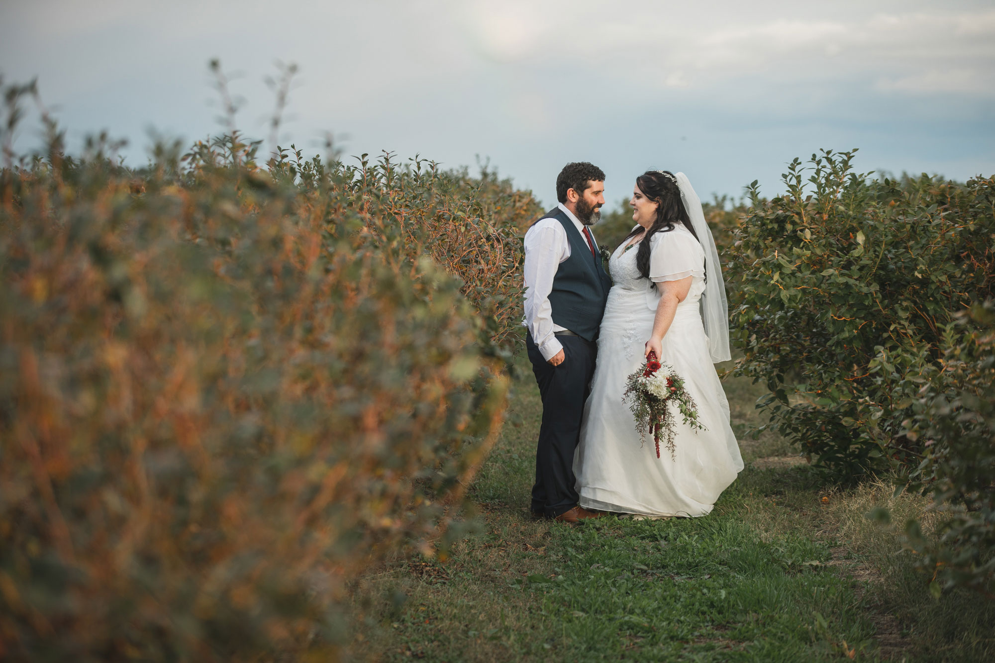 bride and groom fruit orchard