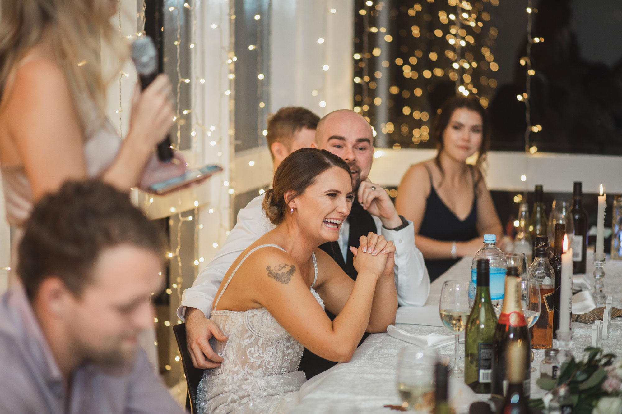 bride and groom laughing