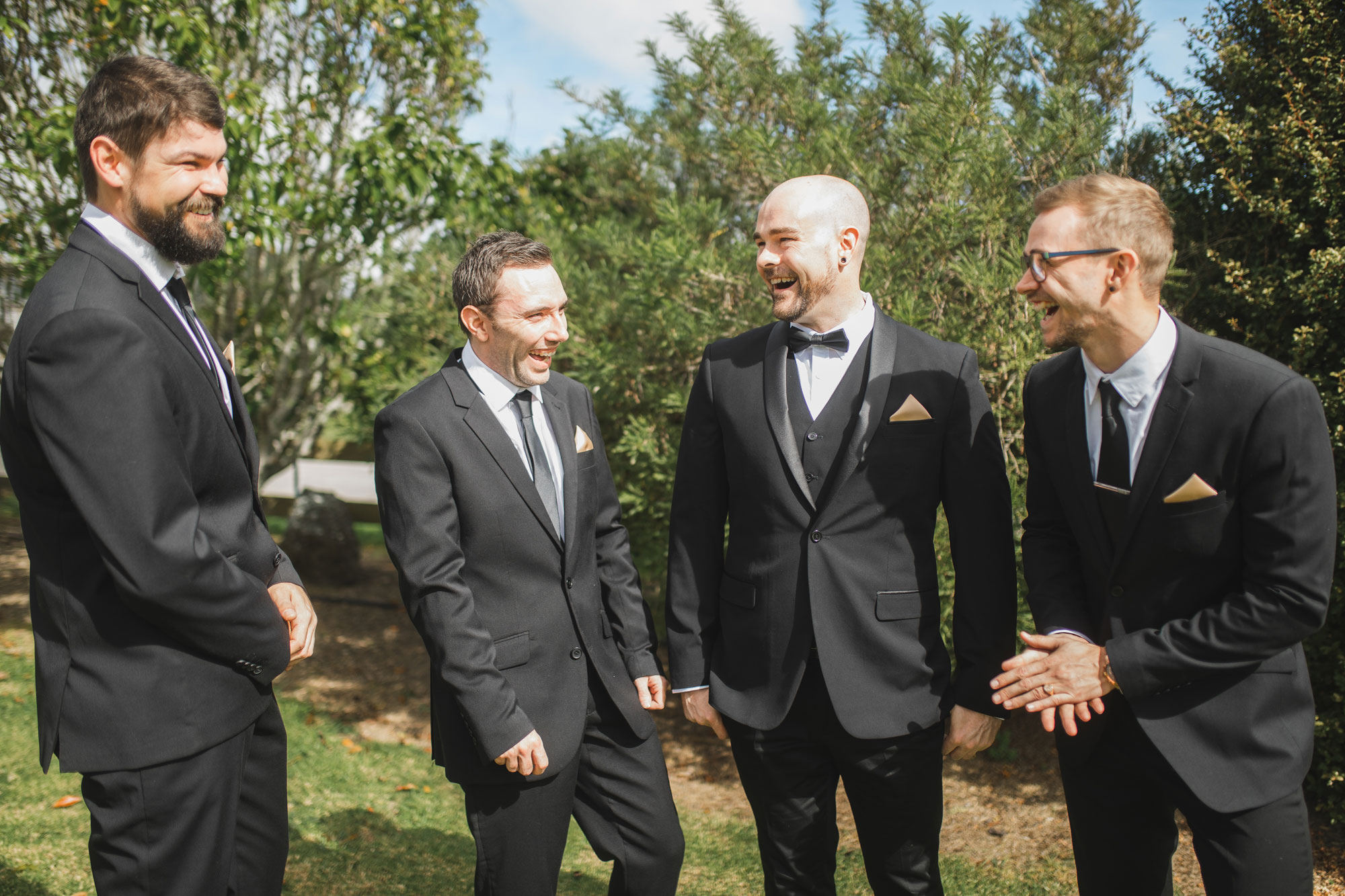 groomsmen and the groom having fun