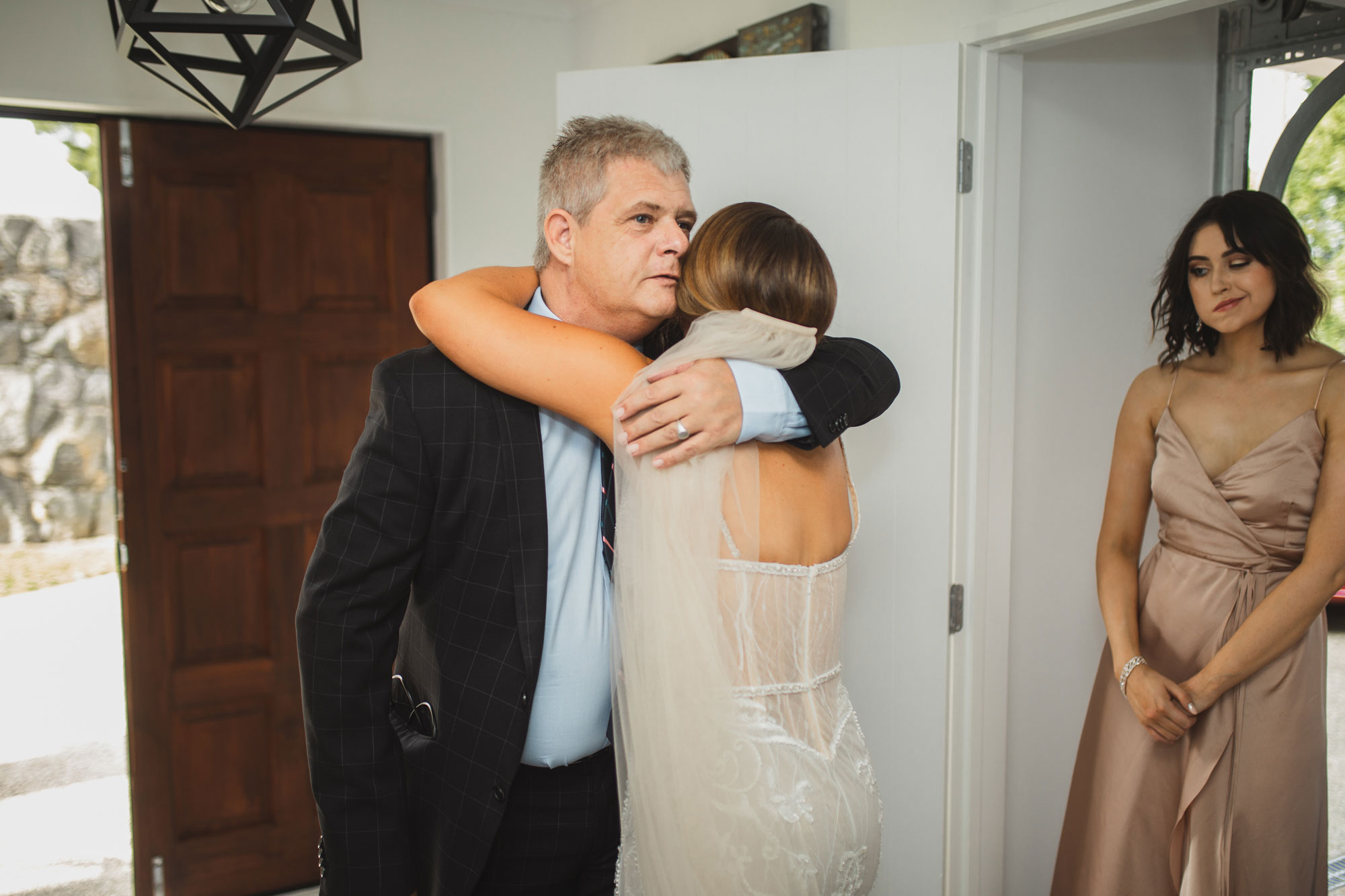 bride and father hug