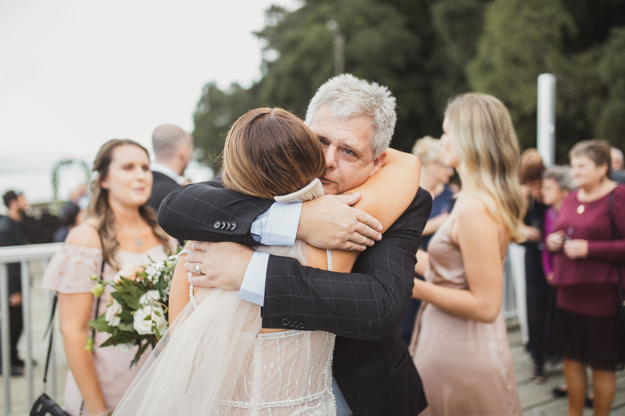 wedding guest hugging