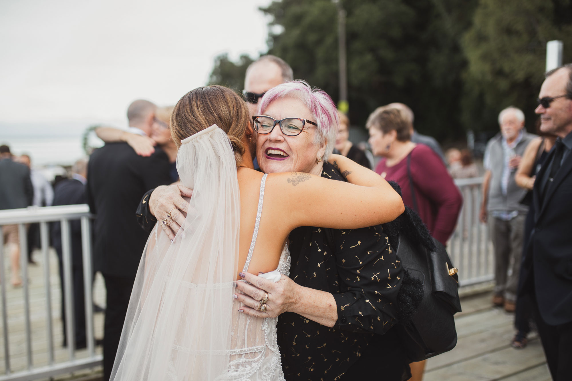 auckland wedding guests hugging