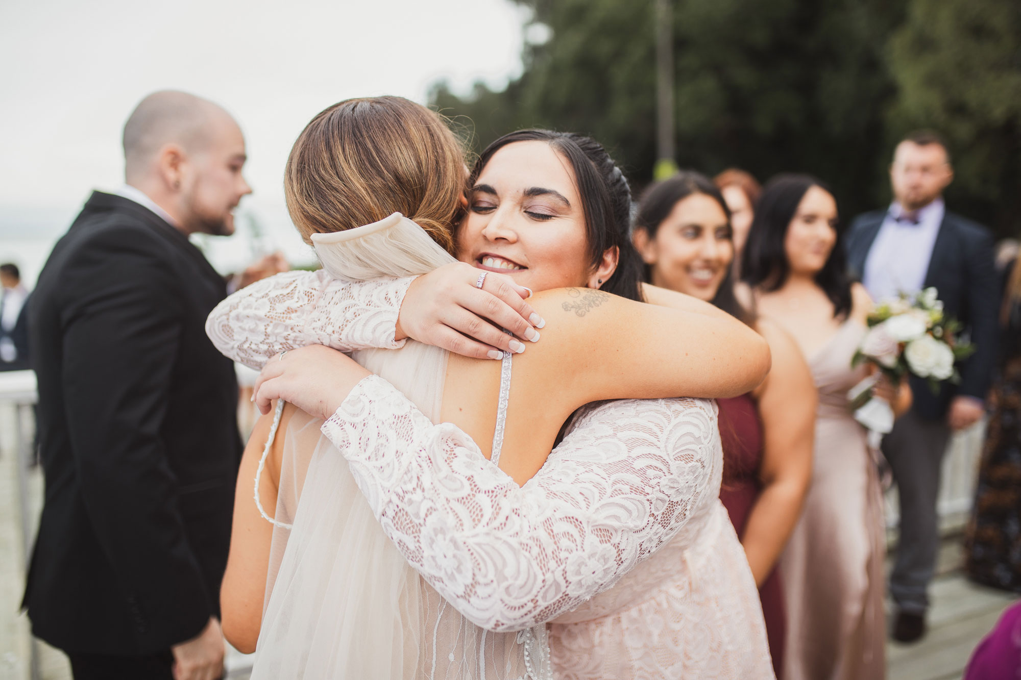 guest hugging the bride