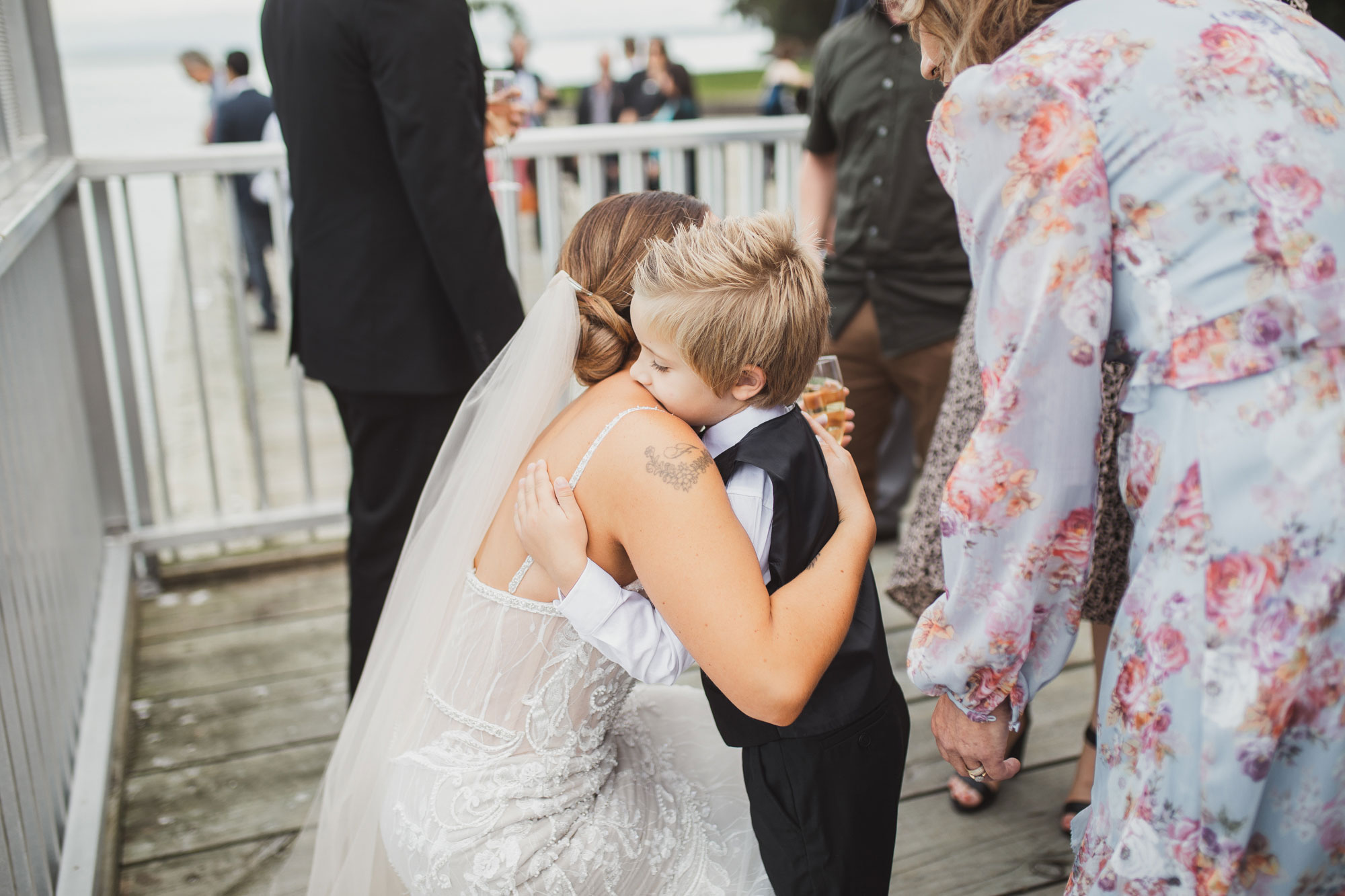 bride hugging little boy