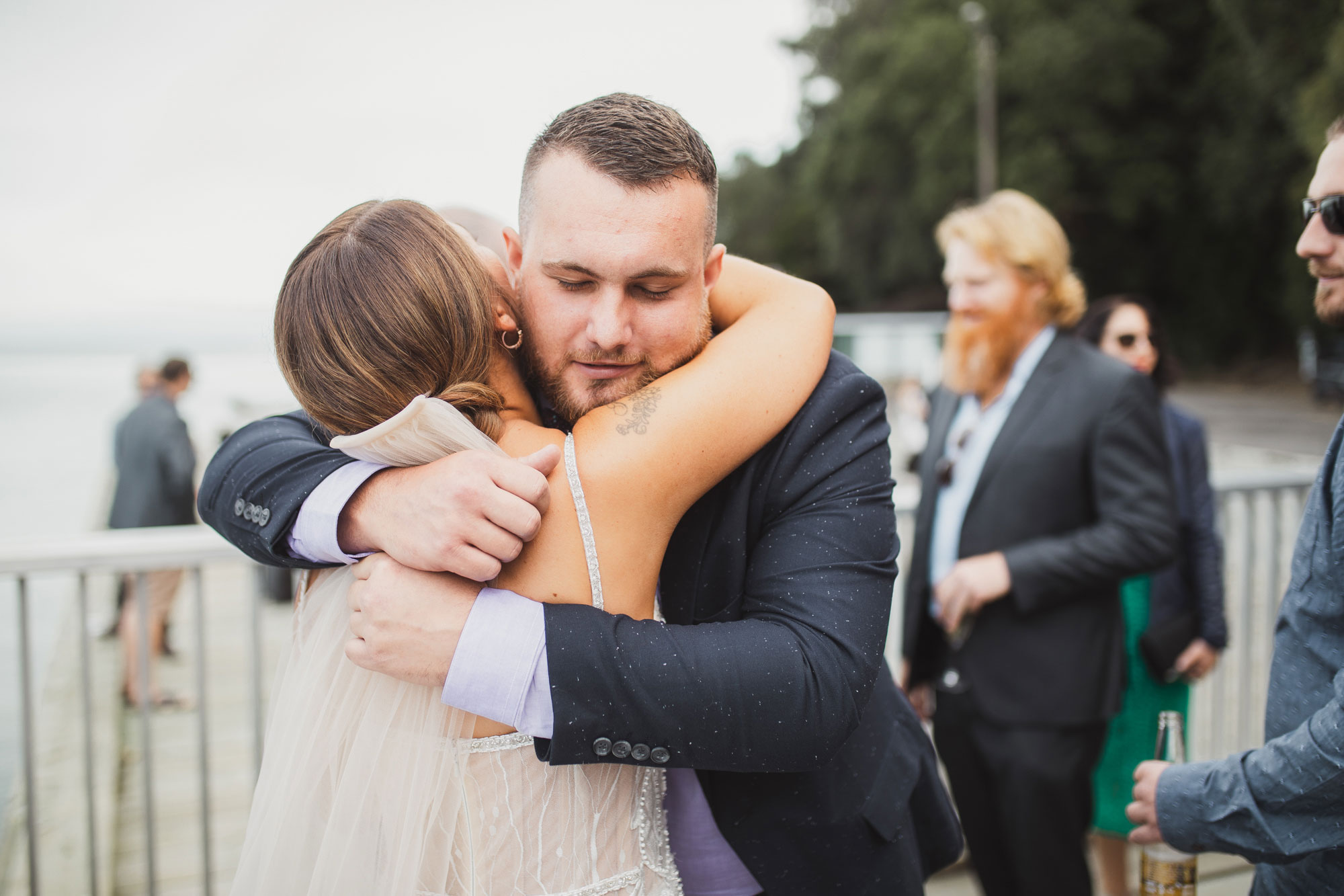 wedding guest embracing bride