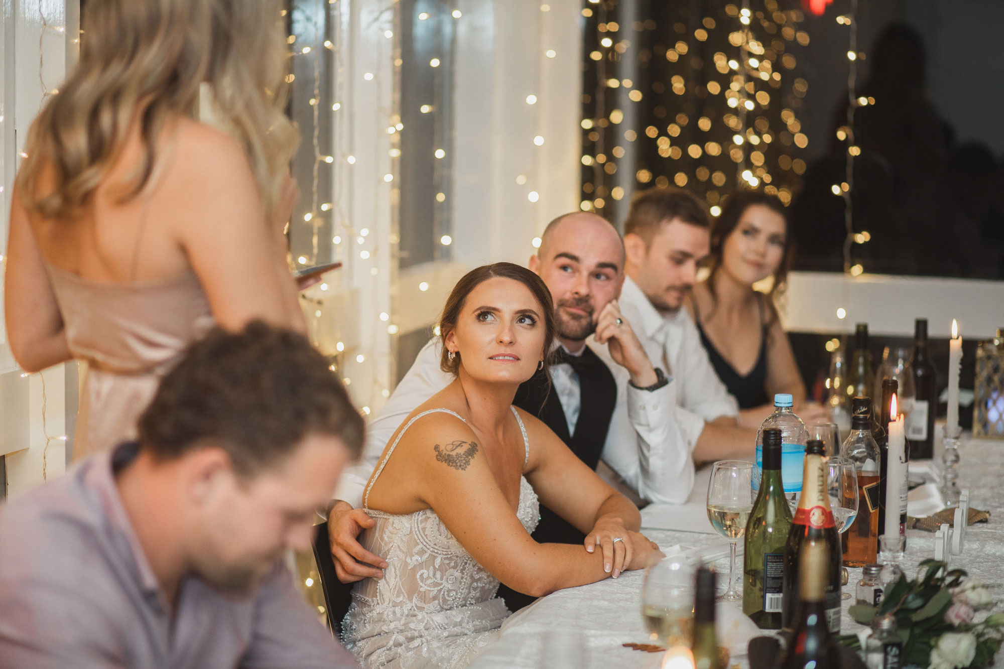 bride listening to sisters speech