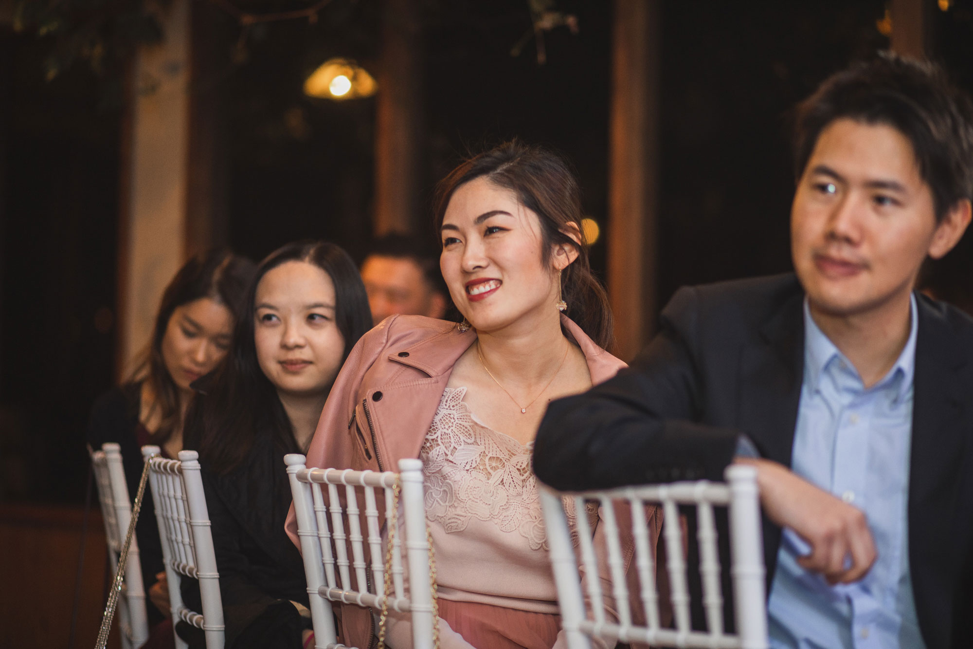 guests smiling at the wedding reception