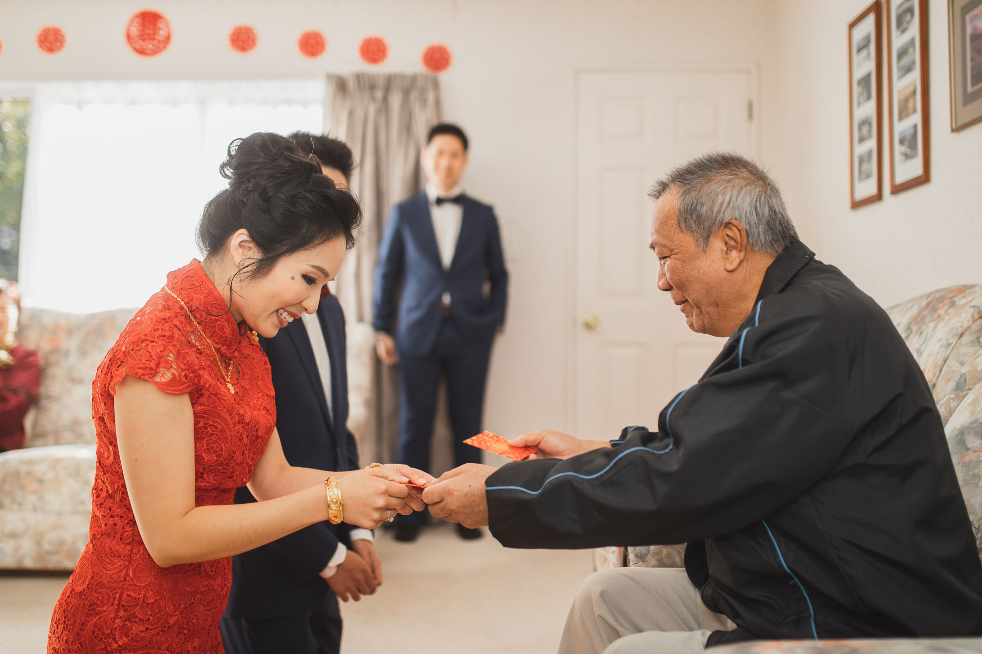 bride receiving red packets on wedding day