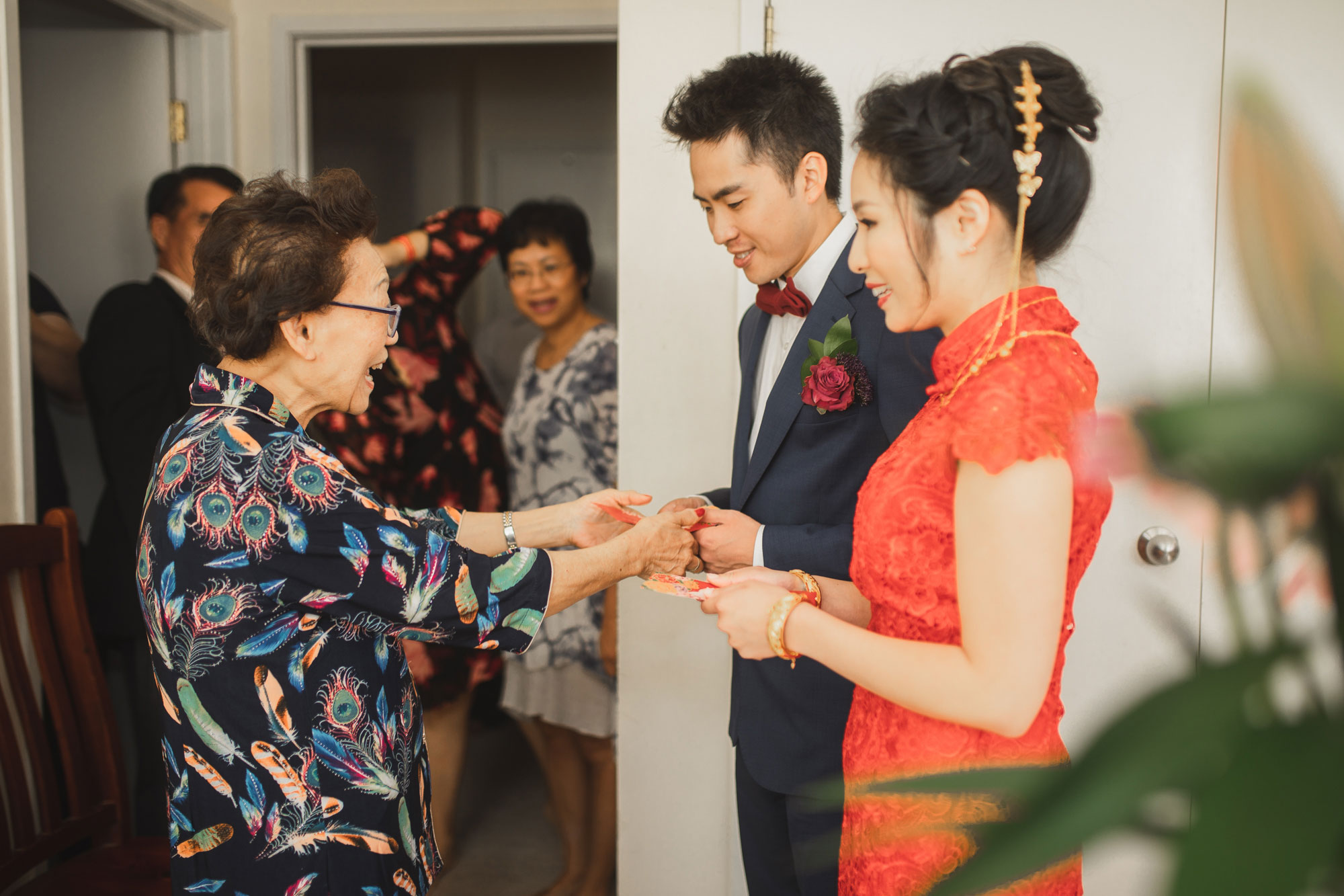 bride and groom serving tea to elder