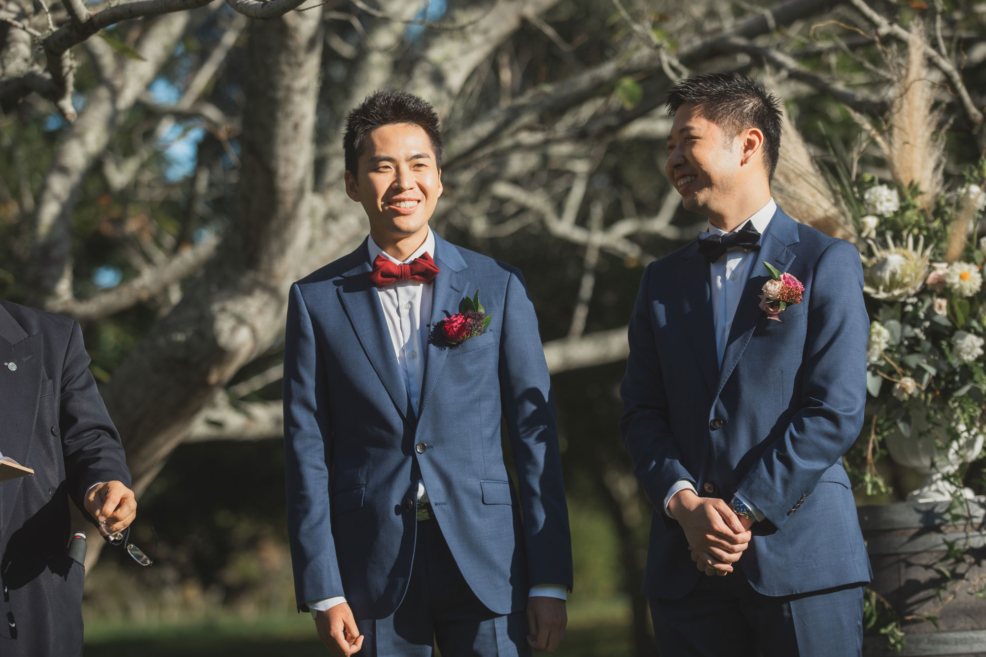 groom smiling waiting for the bride to arrive