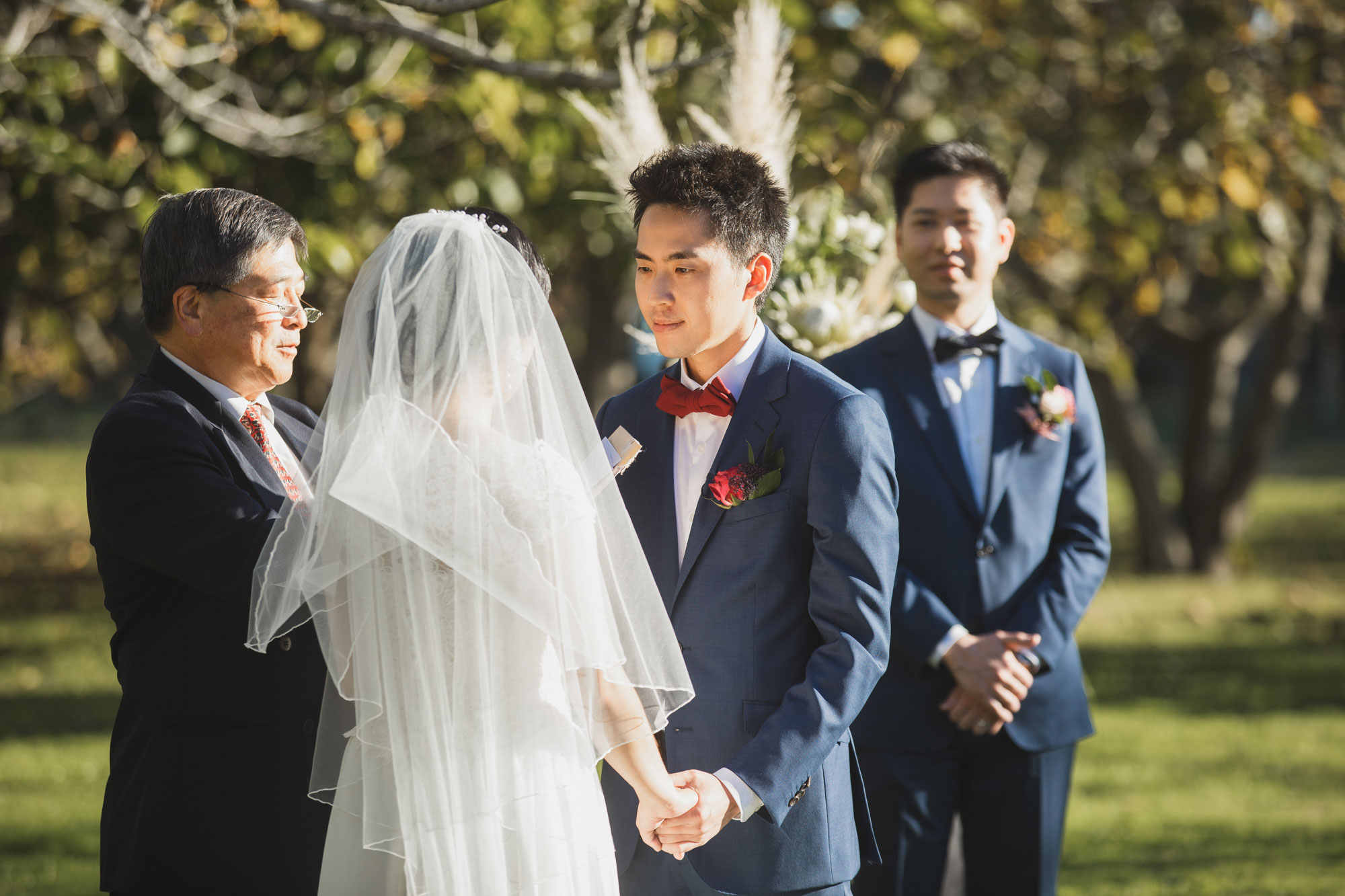 groom saying his vows at the wedding ceremony