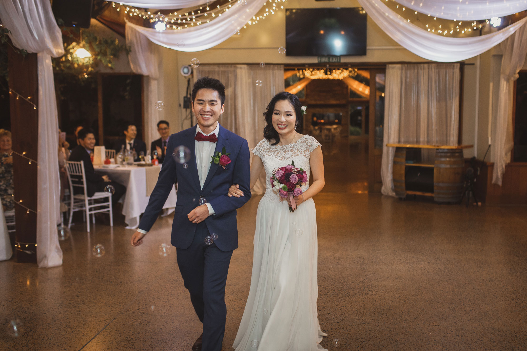 bride and groom announced into wedding reception