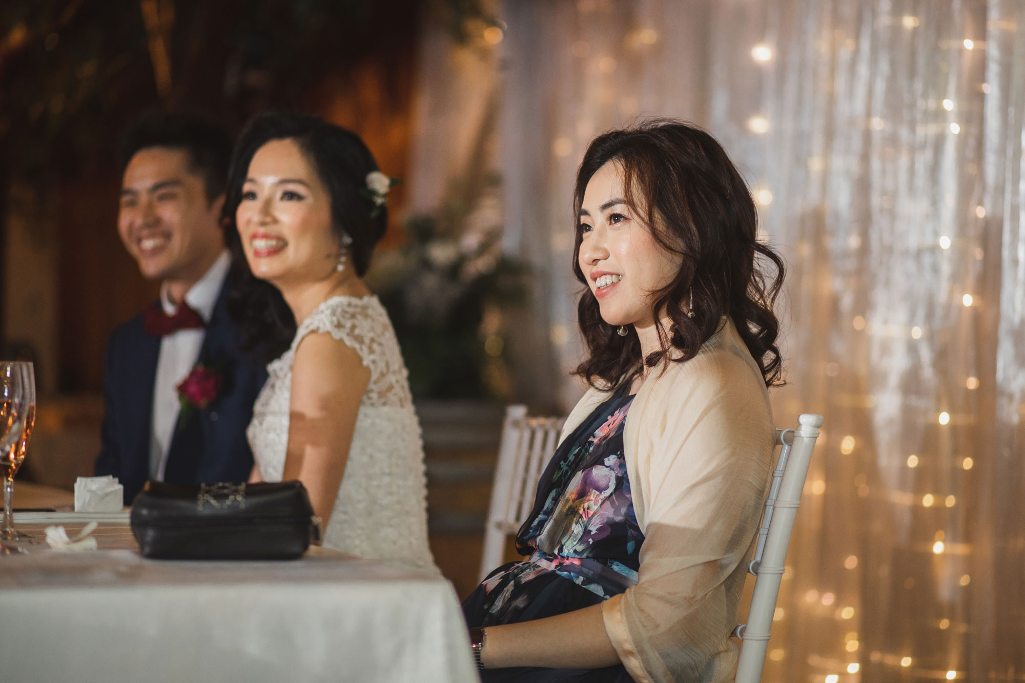 bridesmaid listening to wedding speech