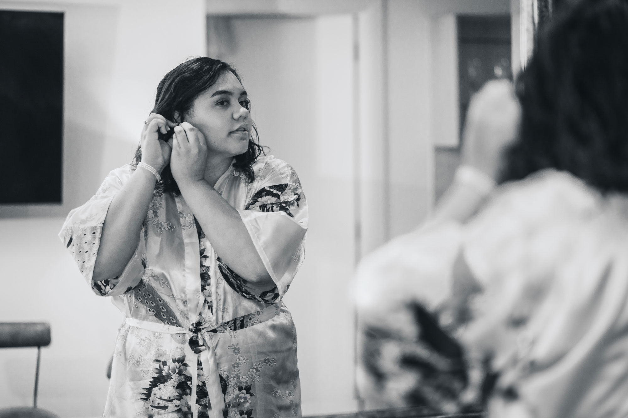 bride putting on earring