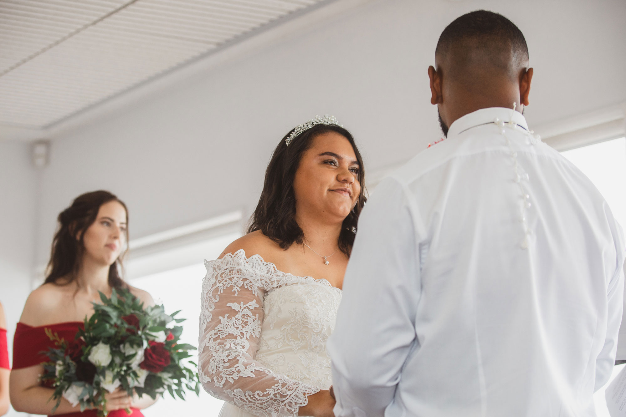 bride smiling at the groom during wedding