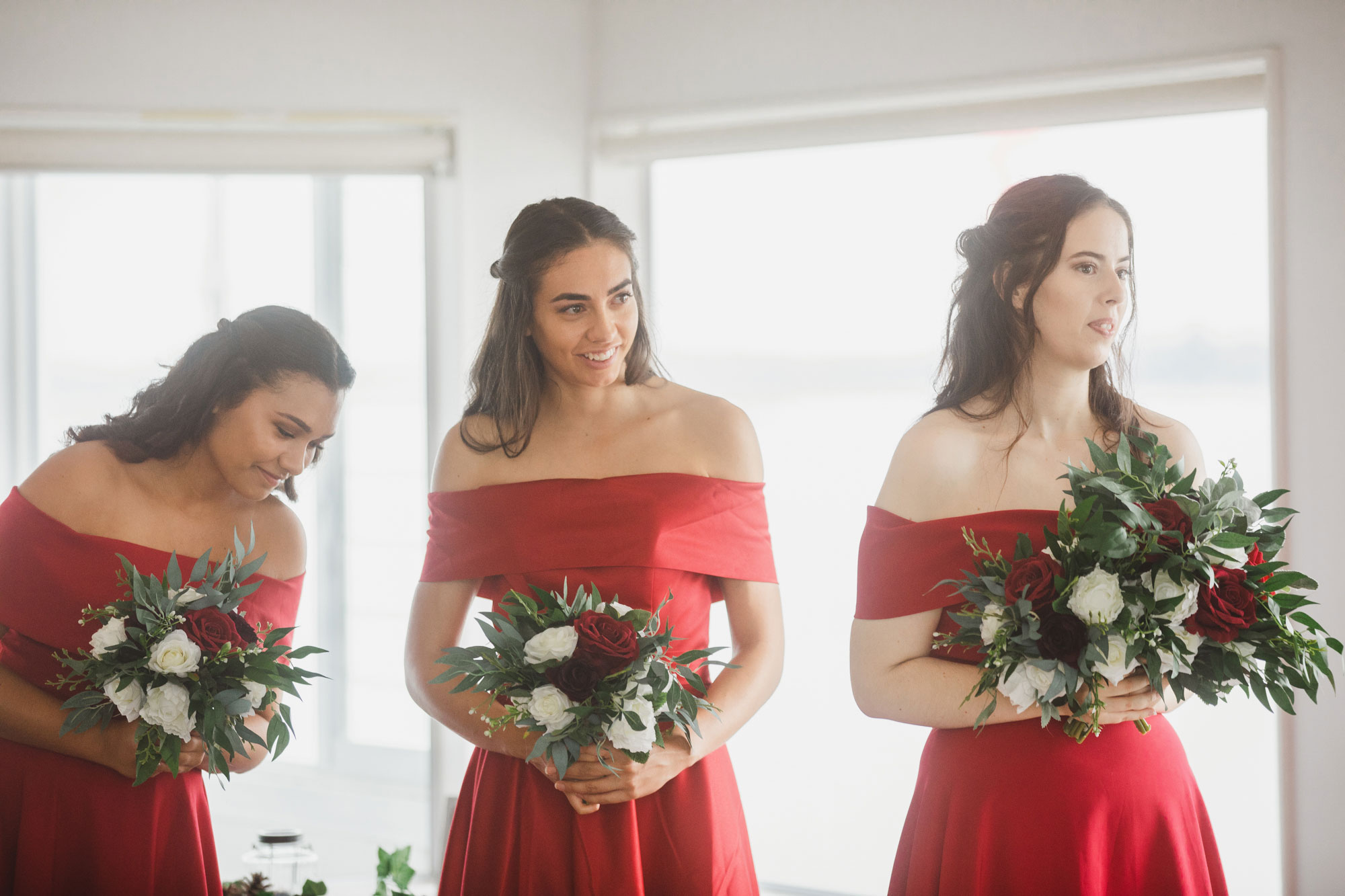 bridesmaids smiling during the ceremony