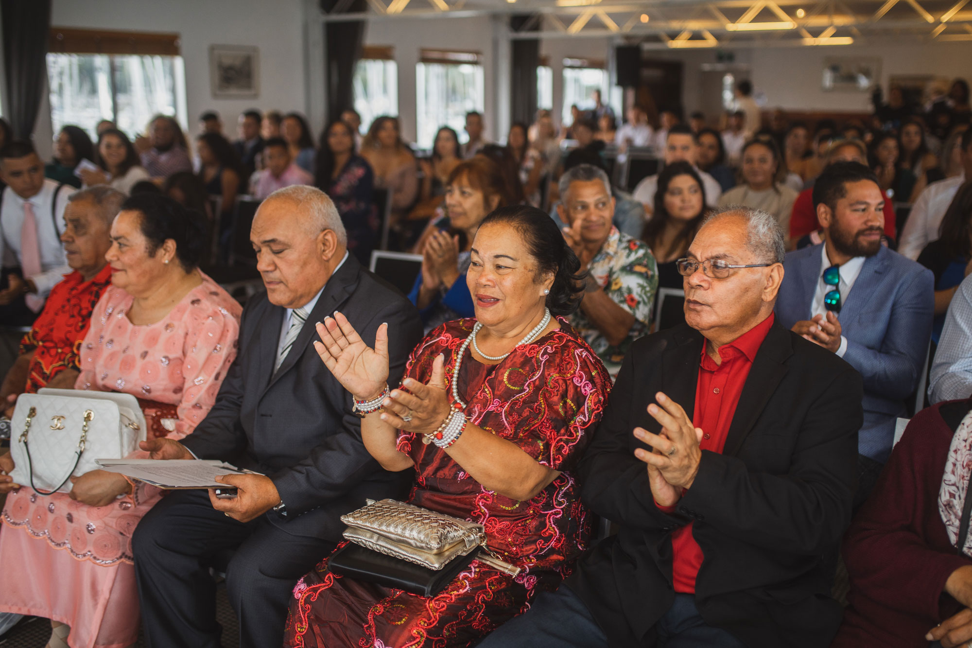 family cheering during wedding ceremony