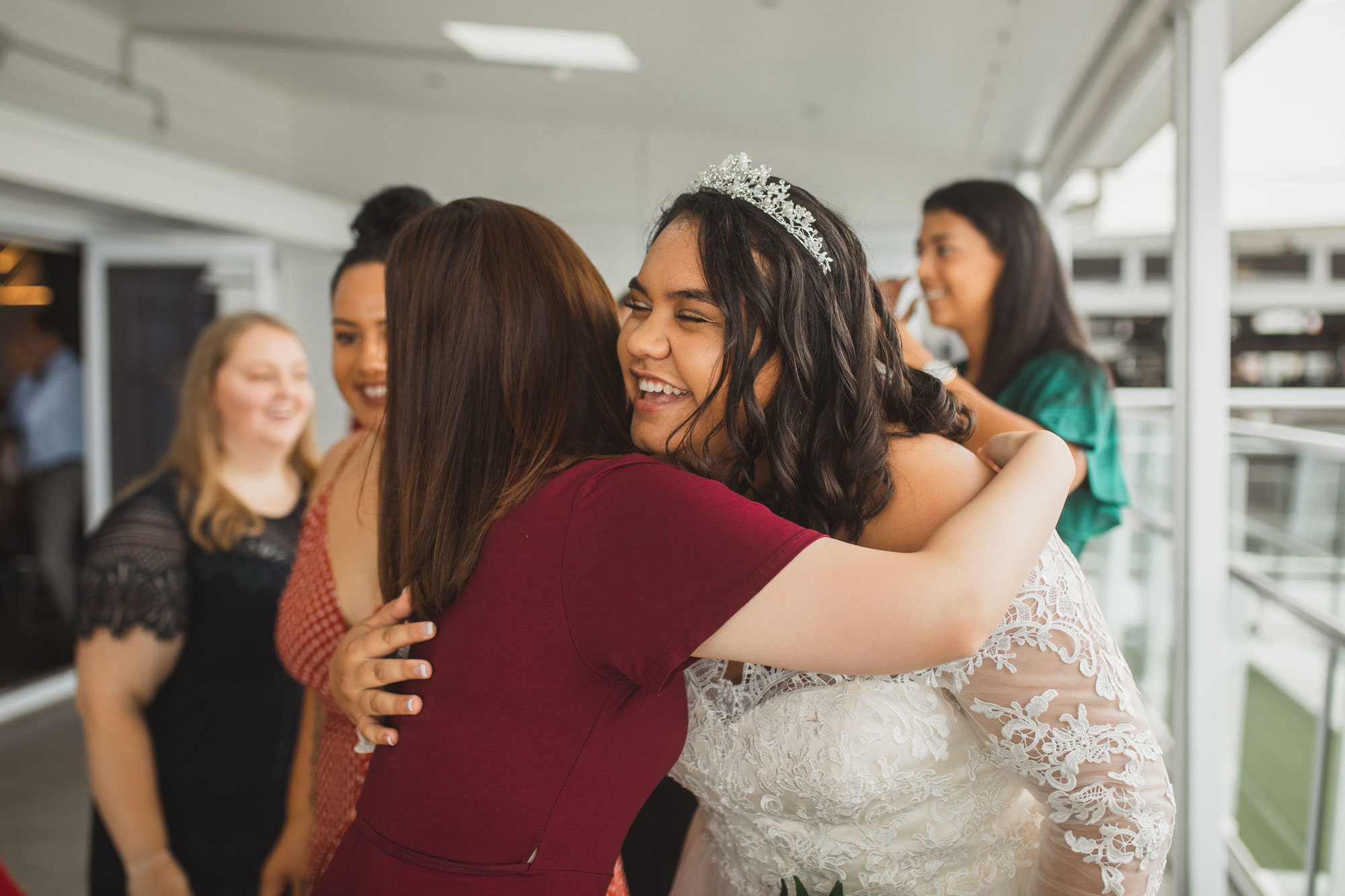 the bride hugging a wedding guest