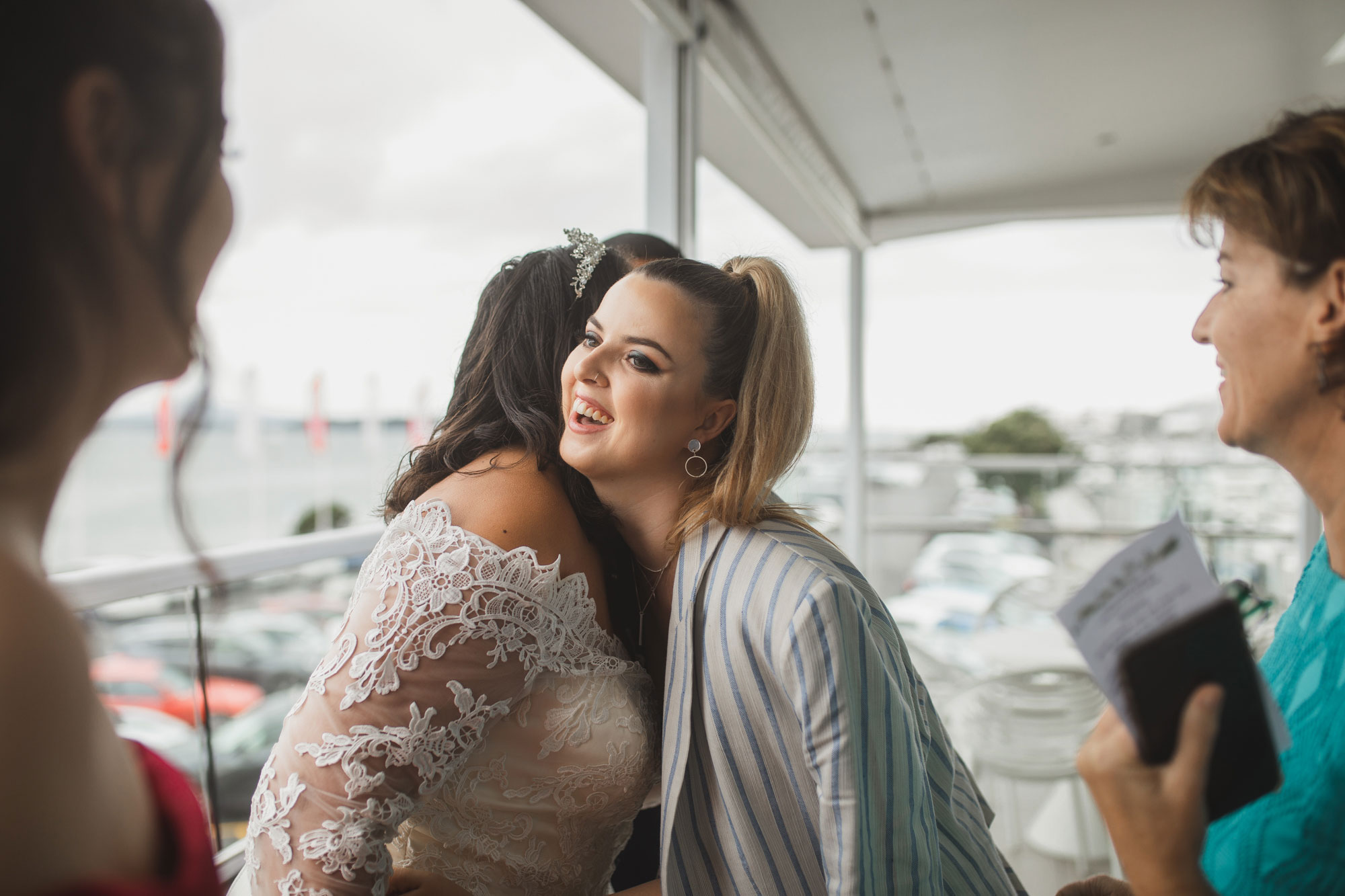 friends of the bride hugging her