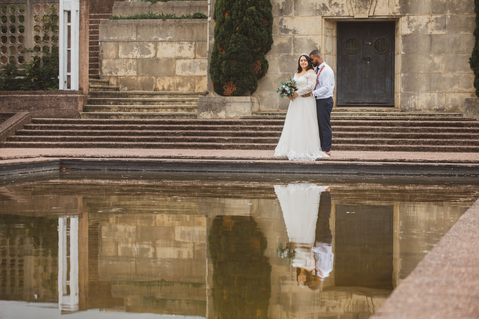 reflection of the bride and groom in auckland