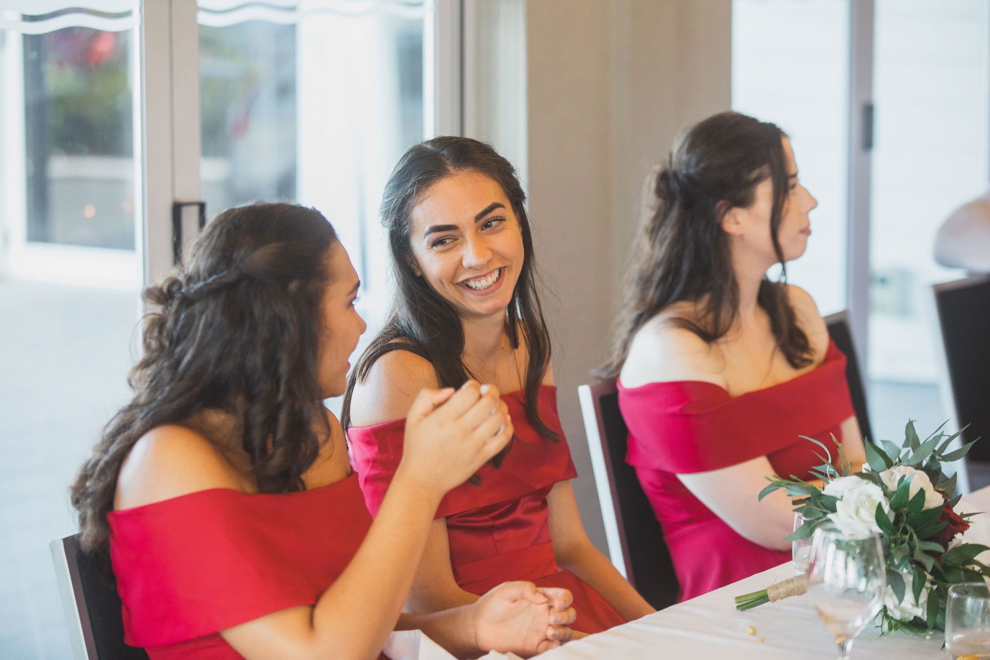 bridesmaids having a chat at the wedding reception