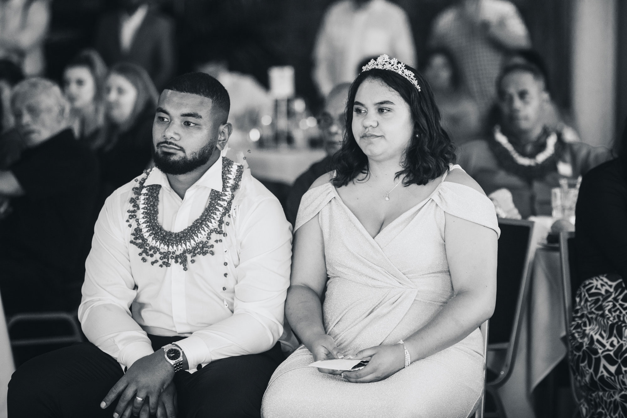 bride and groom watching performance at their wedding