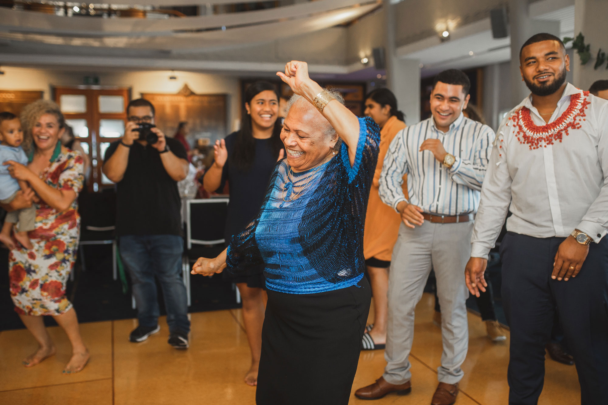 family of the groom dancing at the wedding