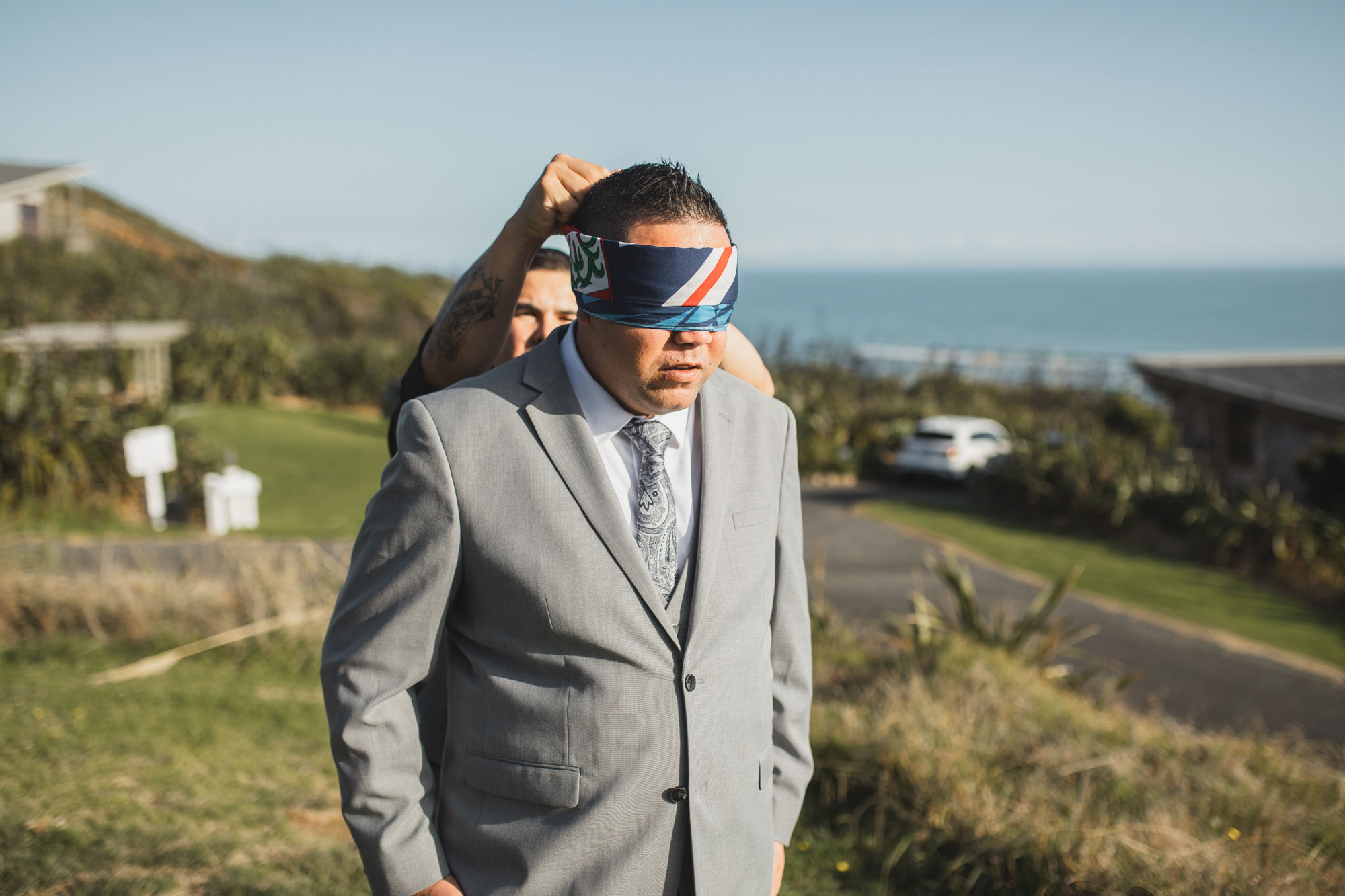 groom getting blindfolded