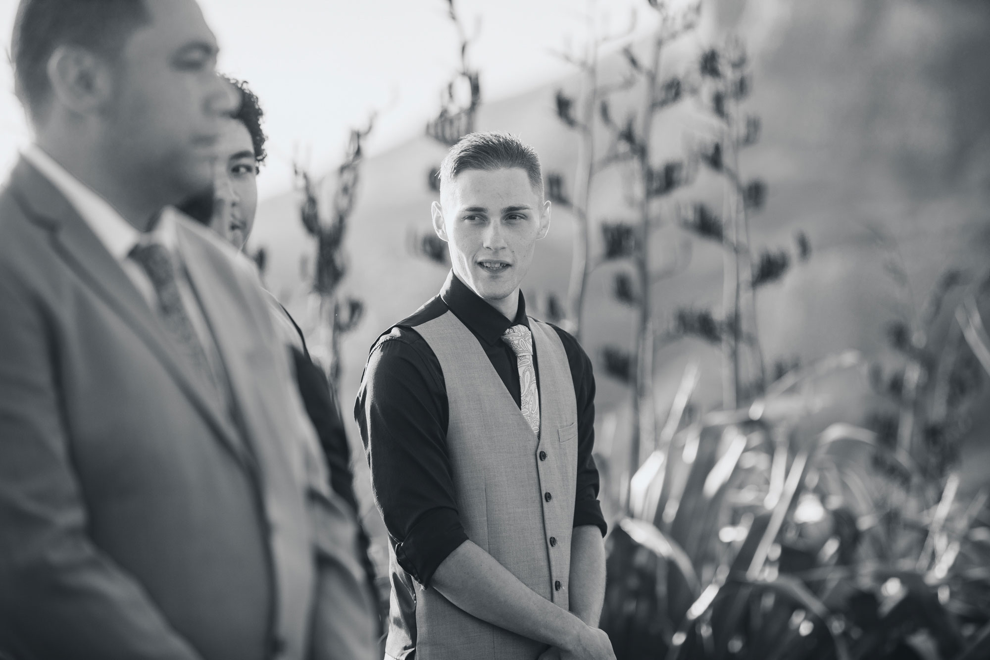 groomsman talking to the groom