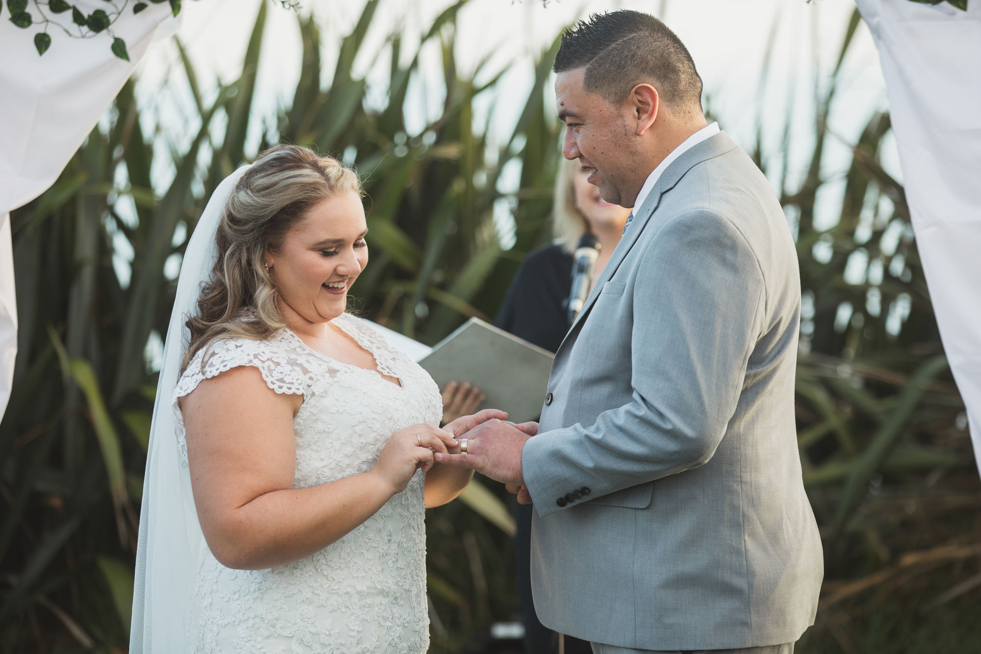 bride putting on the ring