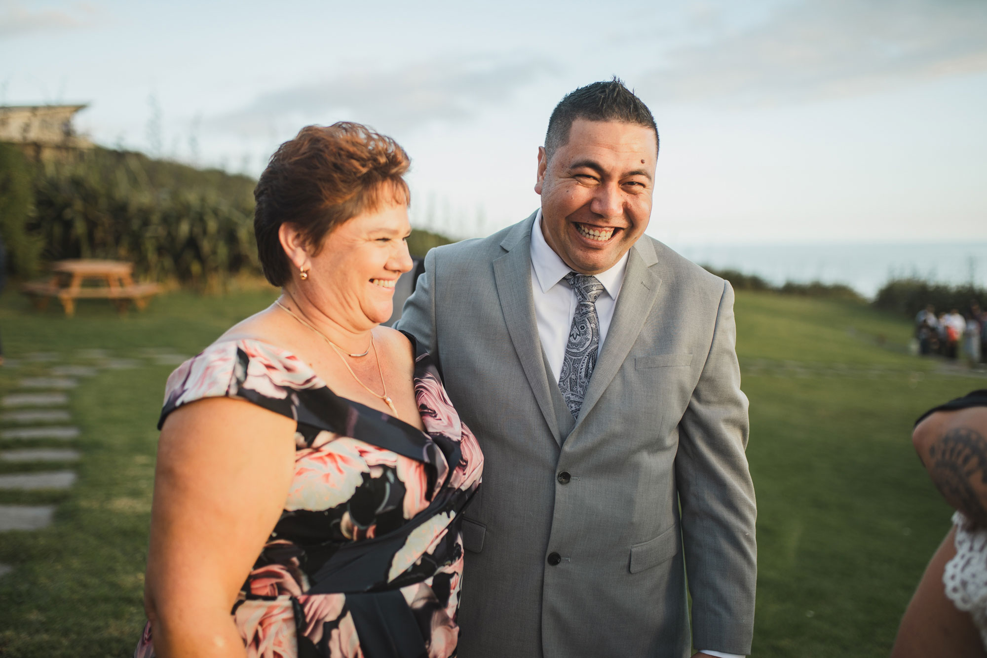 groom and mother of the bride smiling