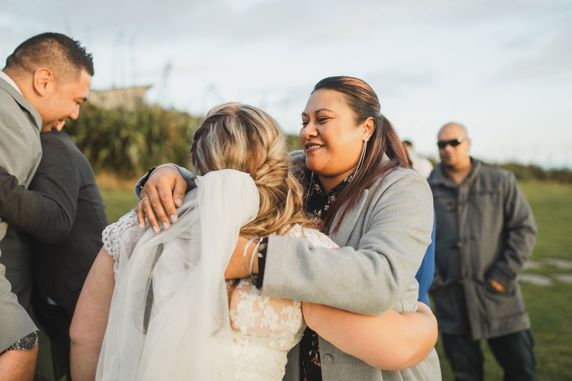 wedding guest hugging the bride