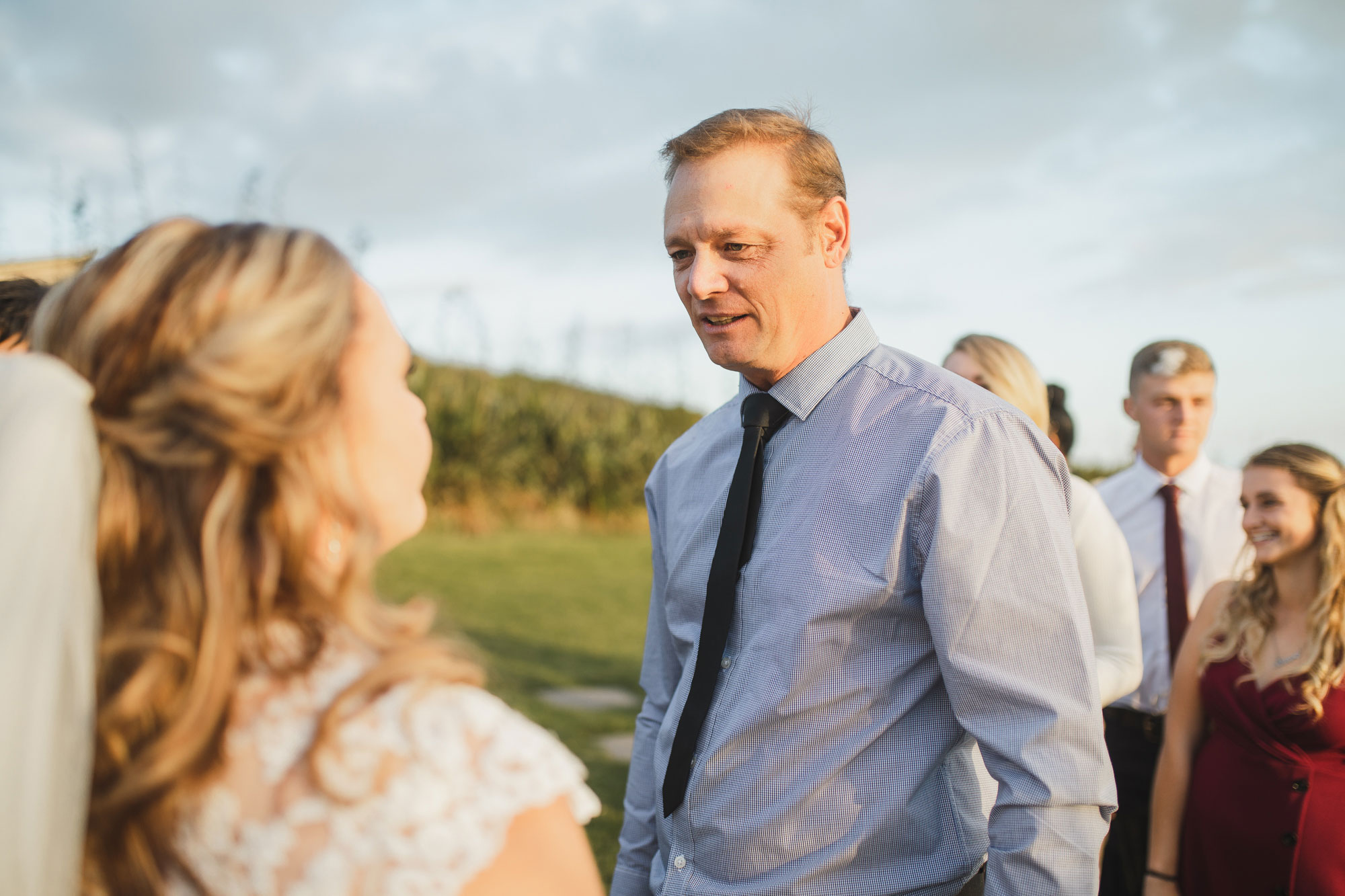 wedding guest chatting with the bride