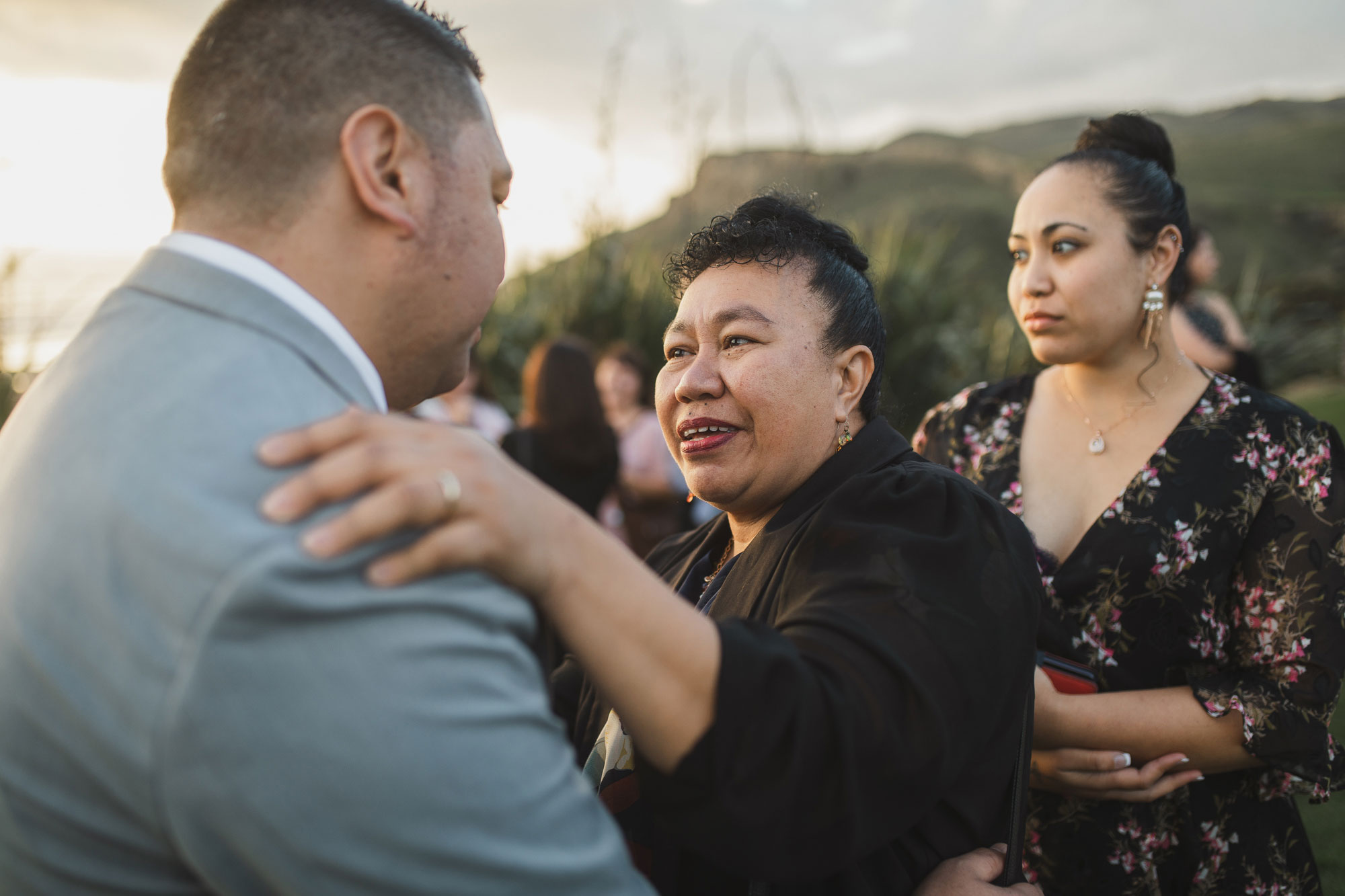 guest congratulating the groom