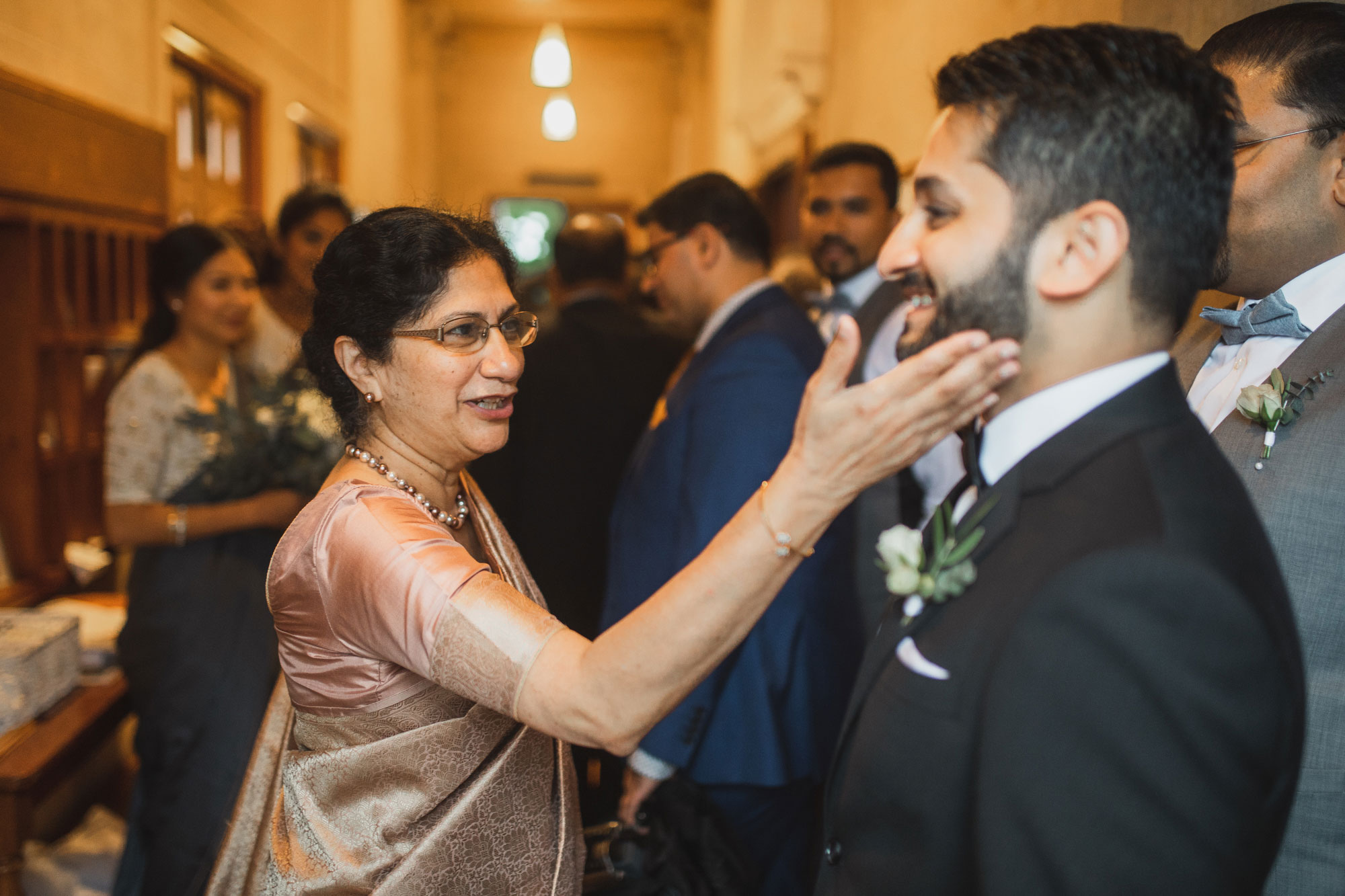 guests congratulating the groom