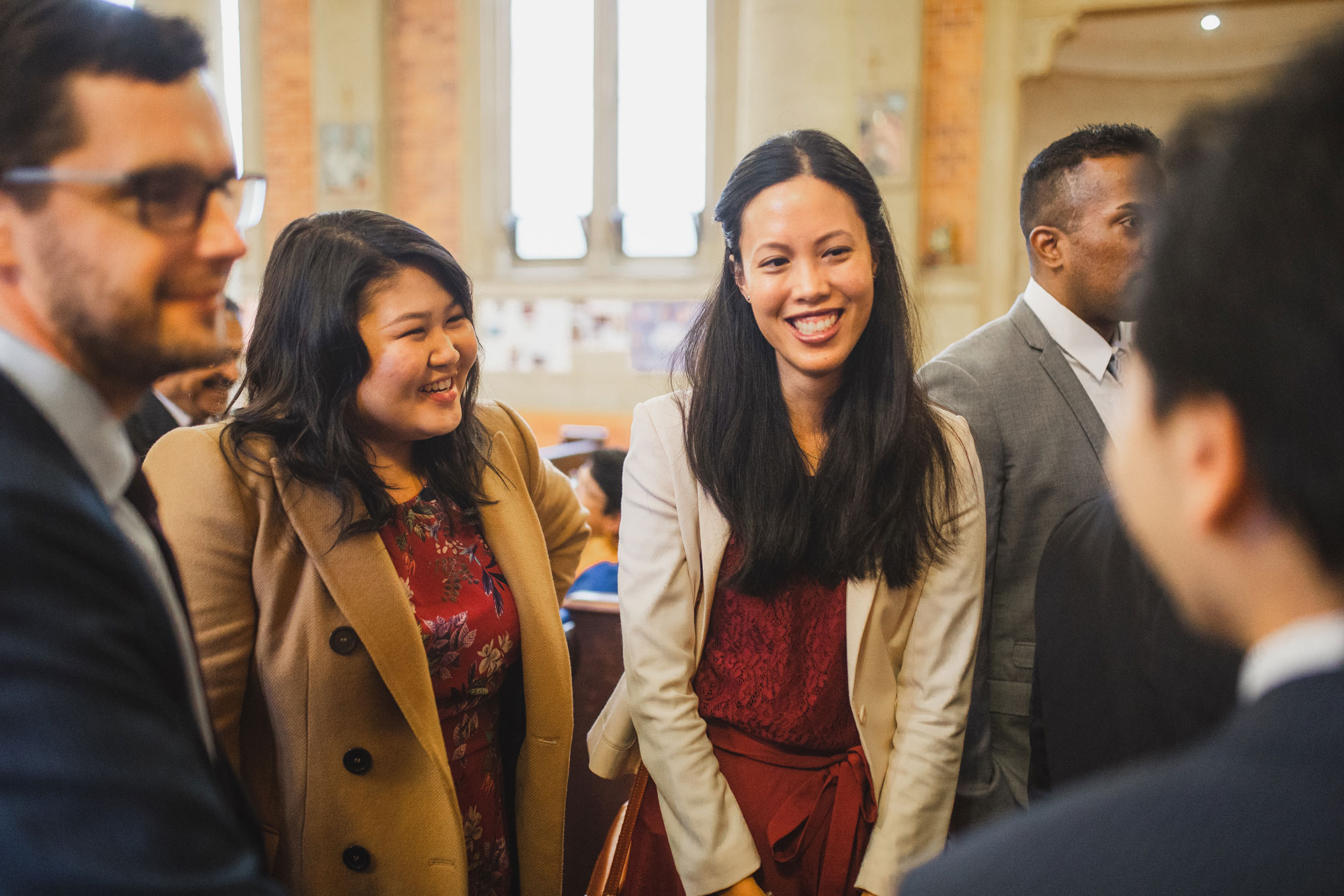 wedding guests laughing in the church