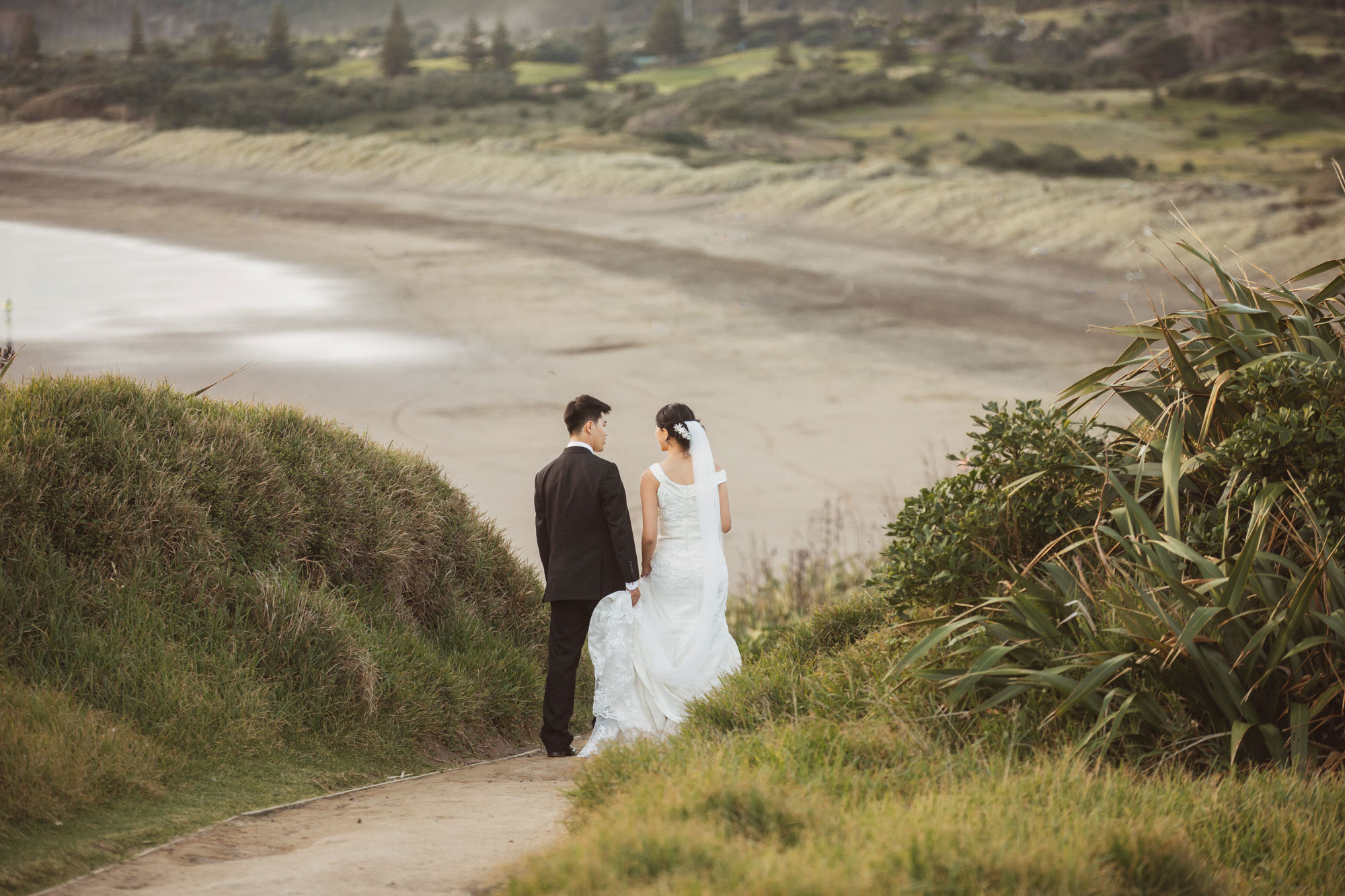 bride and groom at the beach