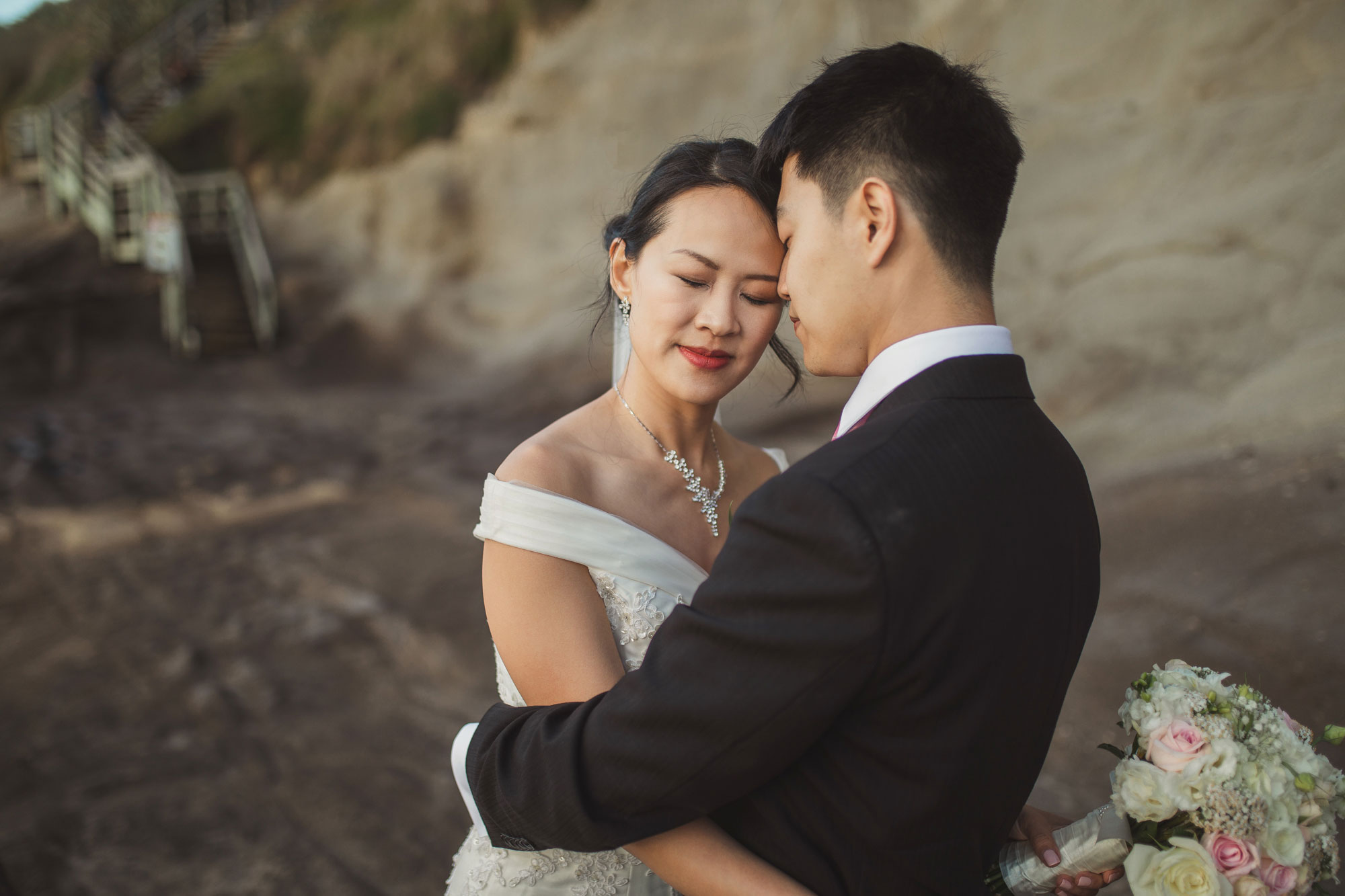 bride in groom's arms