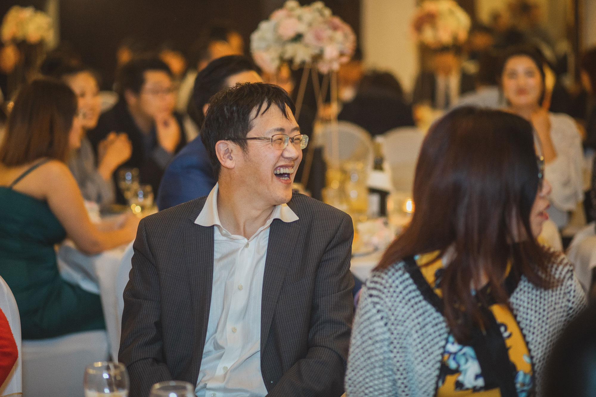 wedding guests laughing